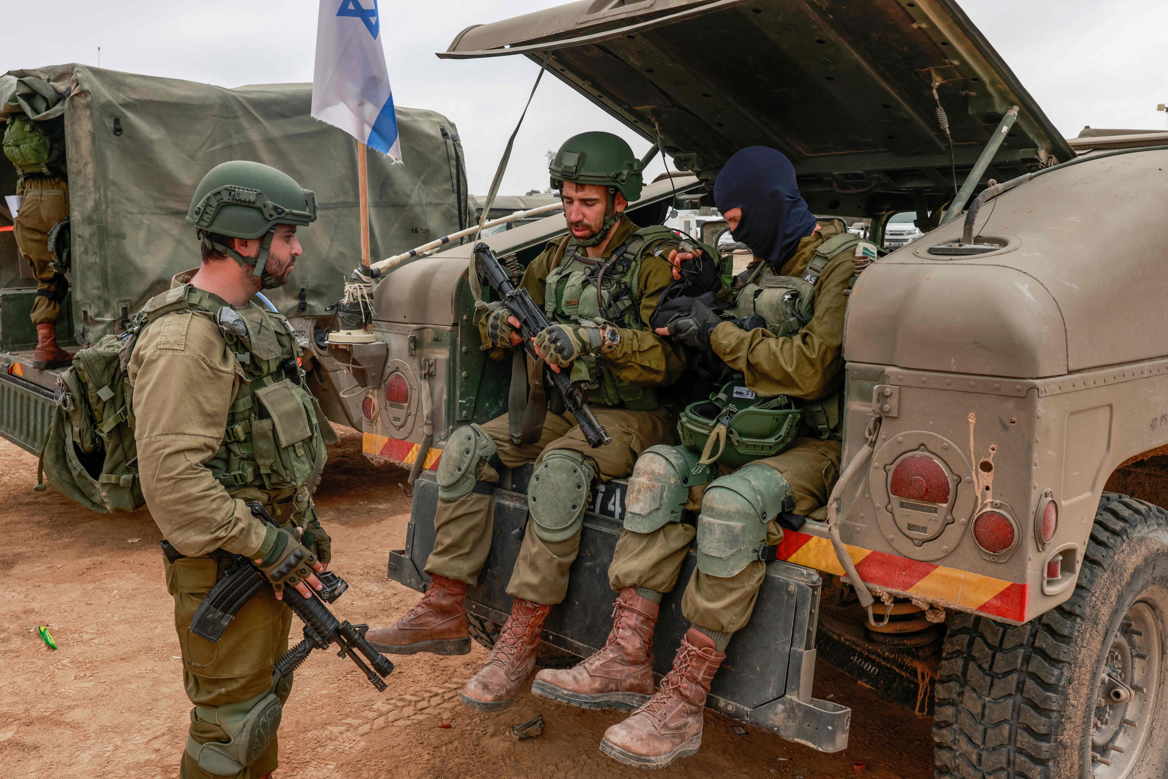 Israeli soldiers gather near the border with the Gaza Strip on Tuesday amid continuing battles between Israel and the militant group Hamas. Photo: AFP