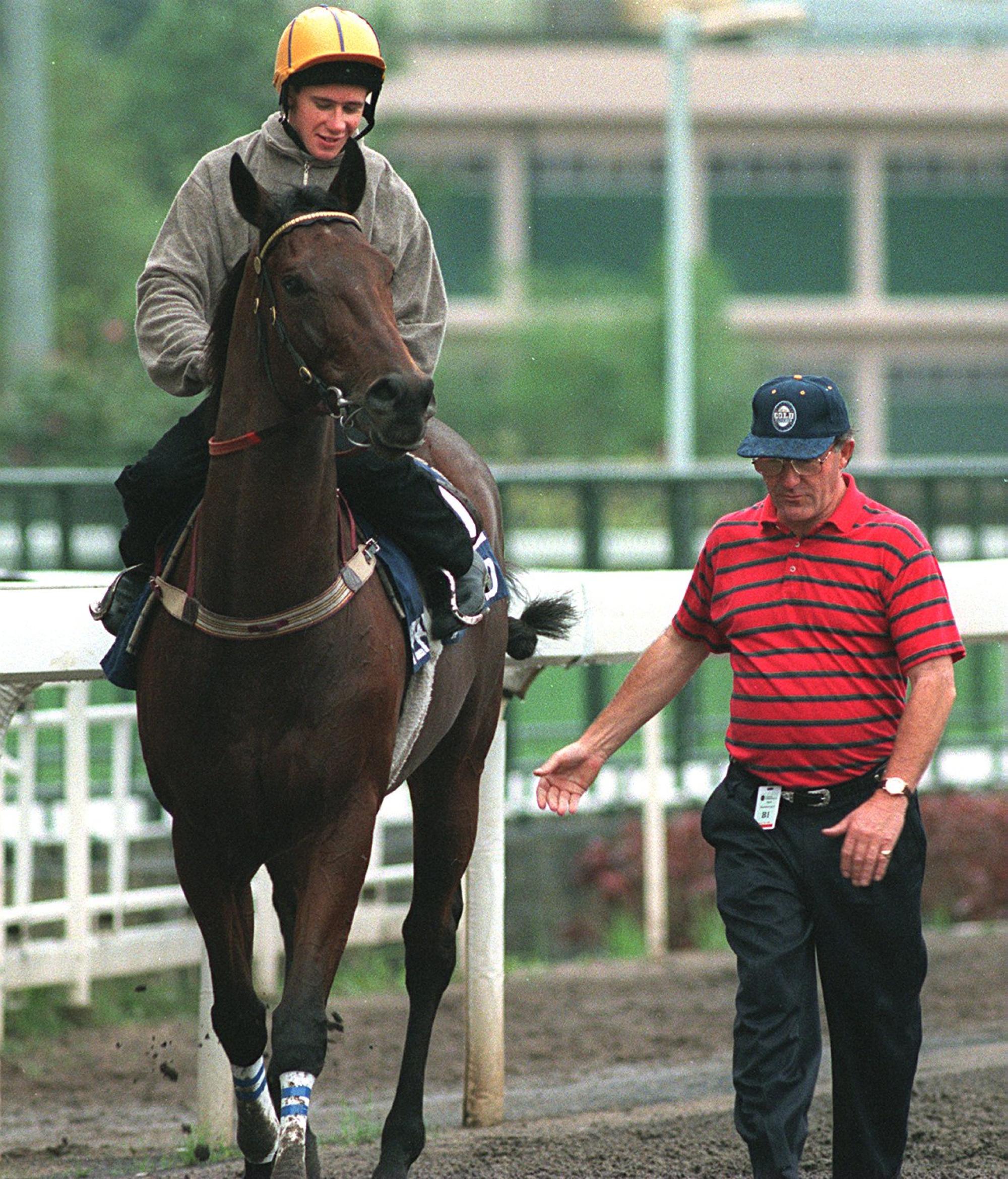 John Meagher walks alongside Perfect Bound at Sha Tin in the build-up to the 1997 QE II Cup. Photo: Oliver Tsang