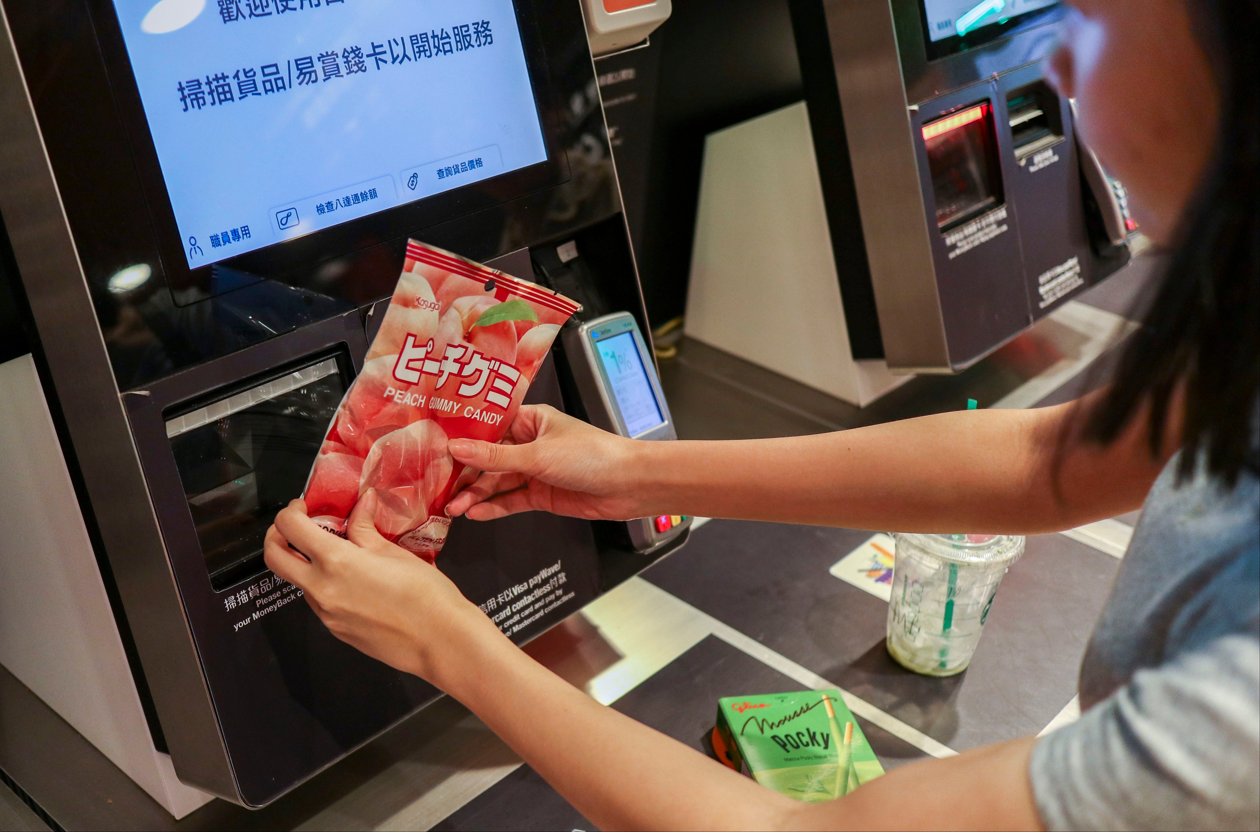A shopper buys goods at a self-checkout machine at the Taste supermarket in Amoy Plaza, Kowloon Bay, Hong Kong. Self-checkouts and self-ordering have become commonplace in the city, but can create problems. Photo: Roy Issa