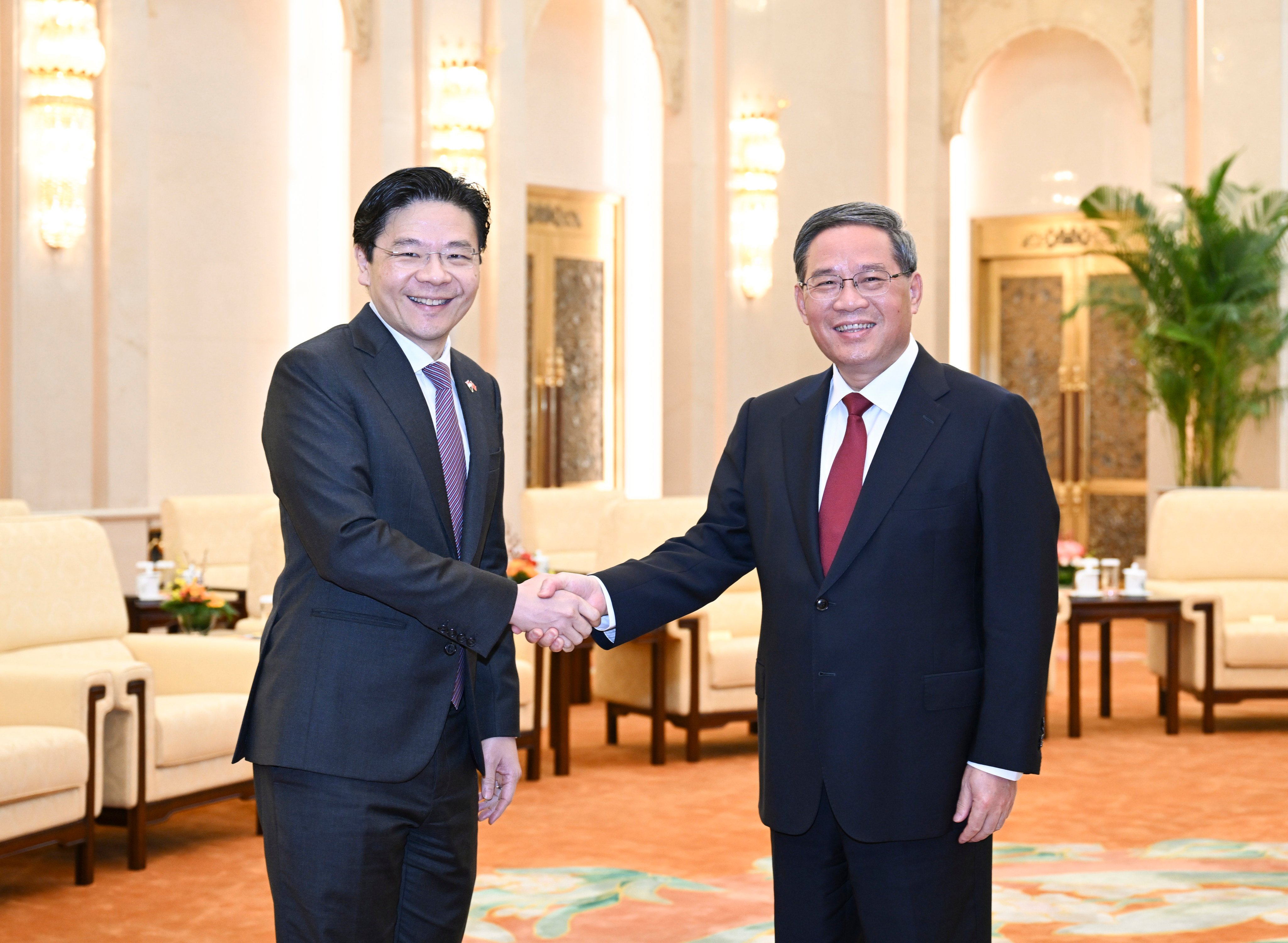 Singapore’s Deputy Prime Minister Lawrence Wong meets Chinese Premier Li Qiang in Beijing on May 16. Photo: Xinhua