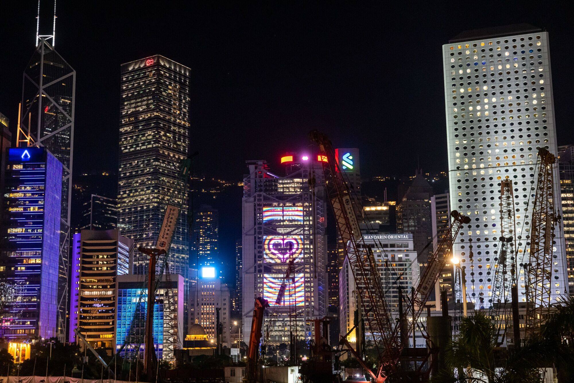 Illuminated office buildings in Hong Kong’s Central district on November 20. Photo: Bloomberg