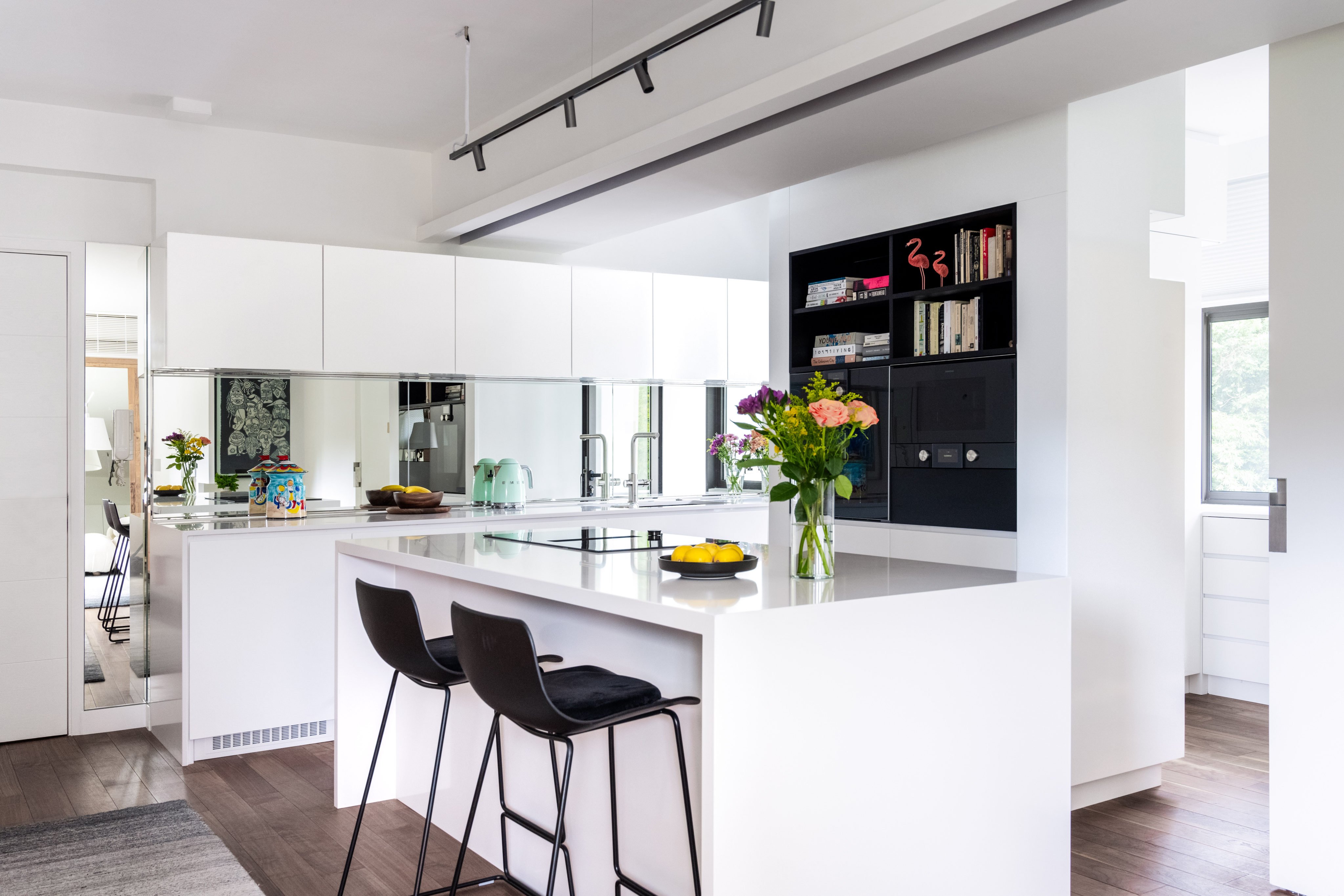 The kitchen space is organised around a central island. Stylist: Flavia Markovits. Photo: Eugene Chan