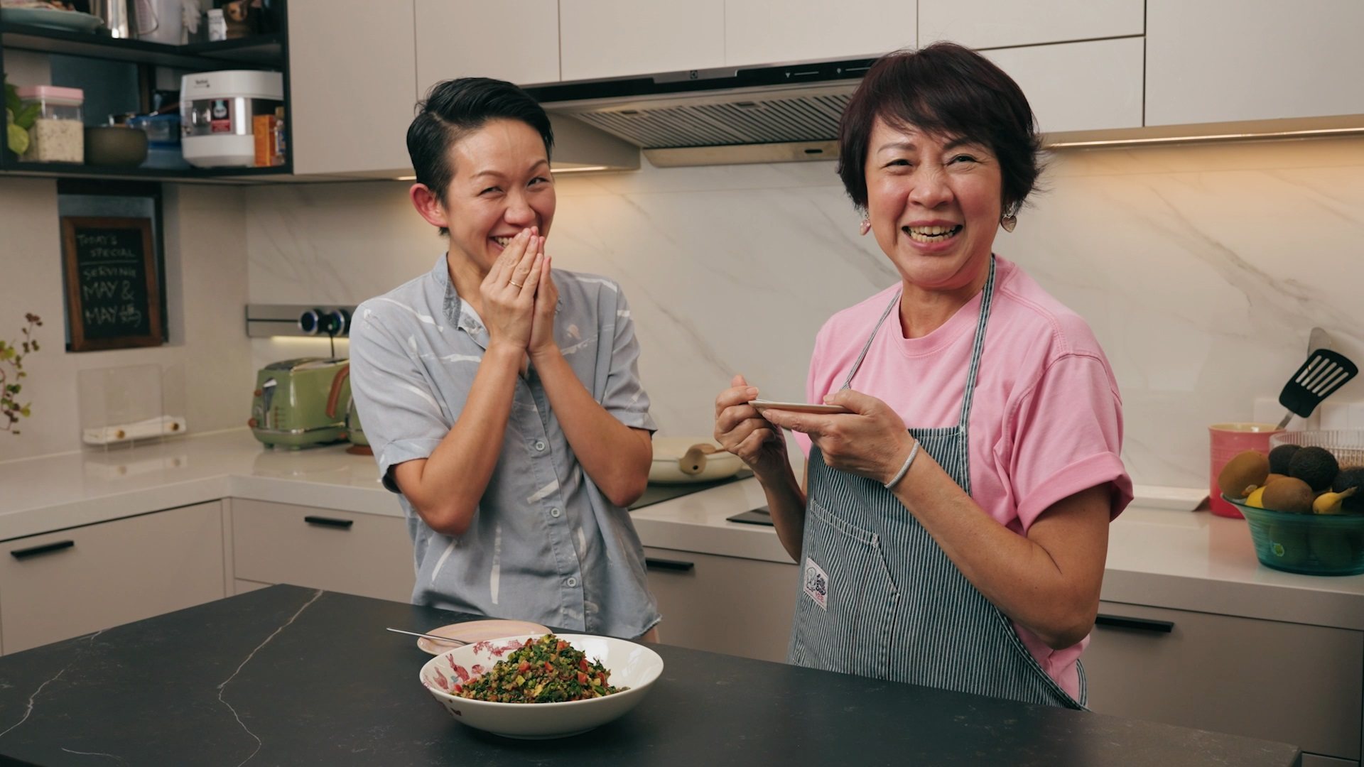 Chef May Chow (left) and her mother, Juliana Foo, discuss wellness while cooking  
their version of the Shanghainese comfort food ma lan tou.