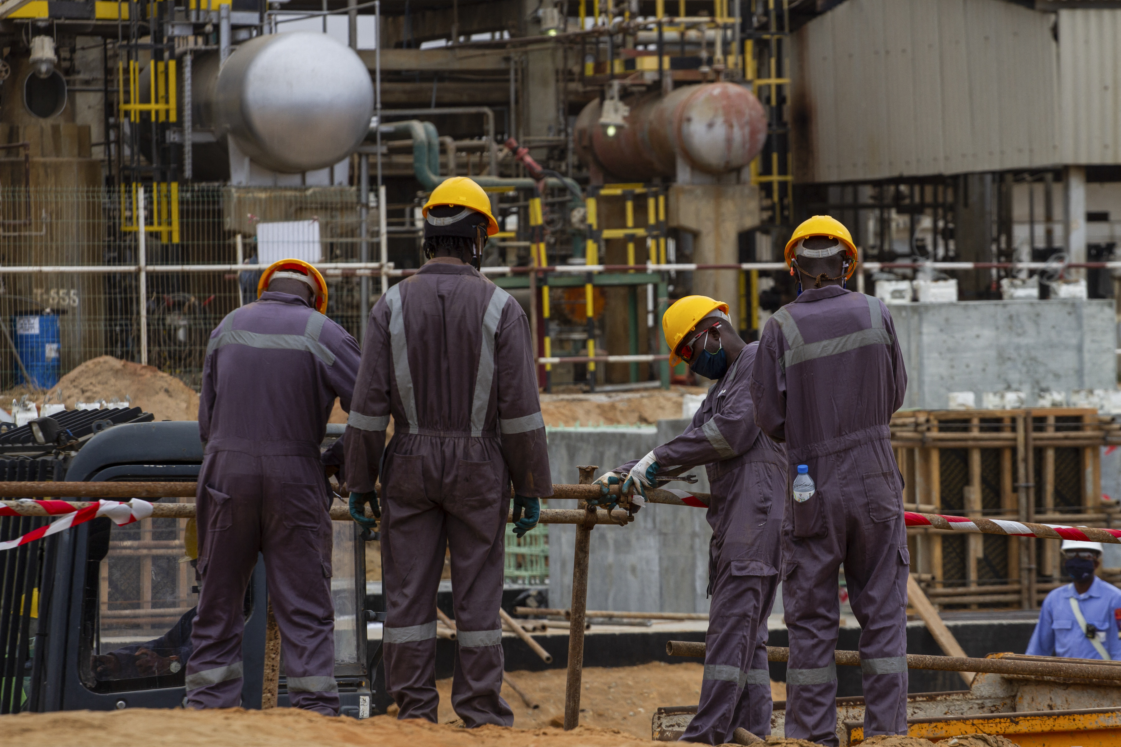 Construction crew members work at the Sonangol Luanda Refinery in Angola in October 2020. The country is Africa’s second-largest oil producer, and much of its petroleum is exported to China. Photo: AFP