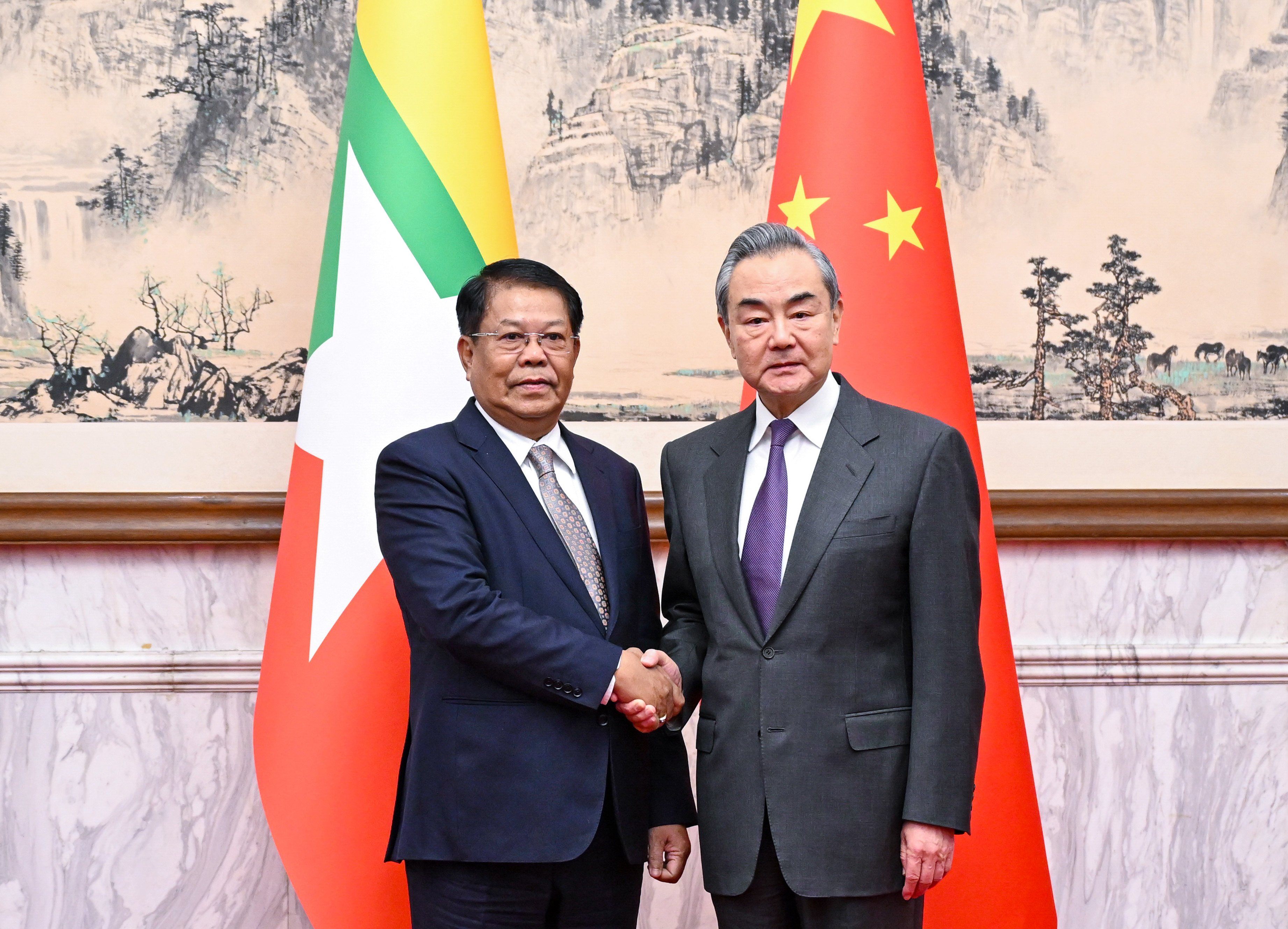 China’s top diplomat Wang Yi (right) meets Myanmar’s Deputy Prime Minister and Foreign Minister Than Swe in Beijing on Wednesday. Photo: Xinhua