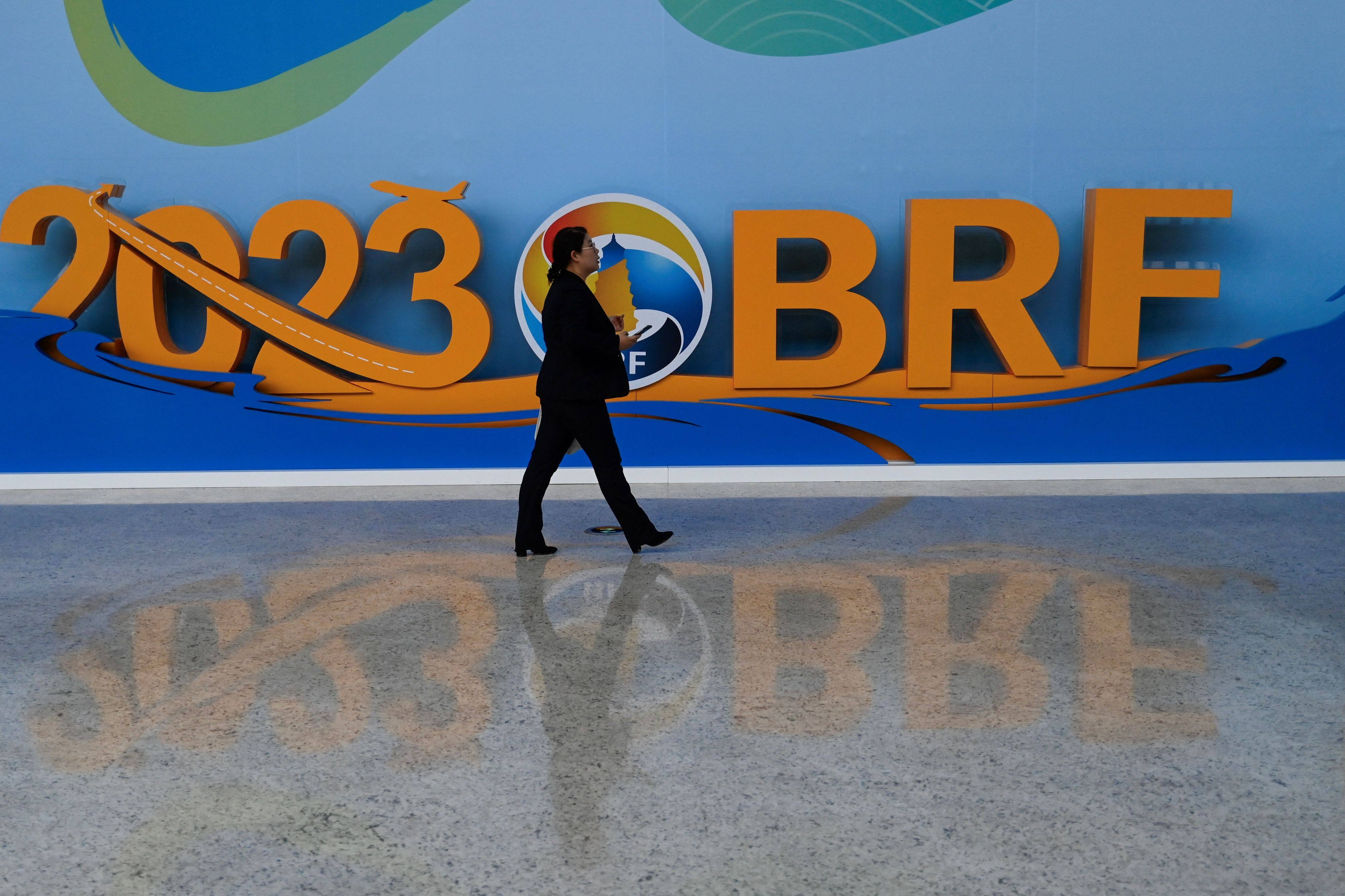 A woman walks in the venue of the Belt and Road forum in Beijing in October. Italy has withdrawn from the China-led investment plan, four years after becoming the only G7 nation to sign up. Photo: AFP