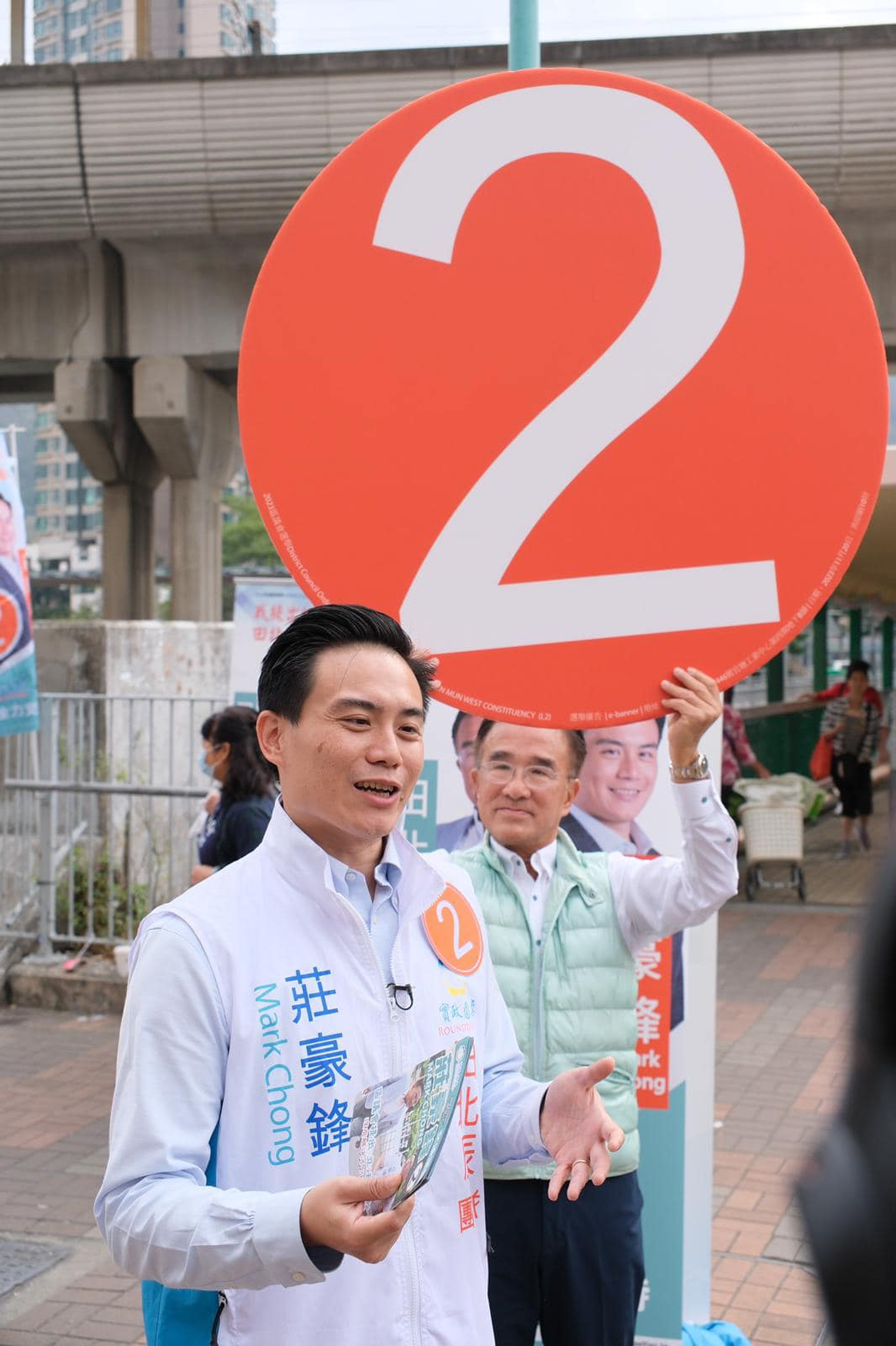 Roundtable candidate Mark Chong (left), pictured with lawmaker Michael Tien, believes he has only a slim chance of winning in the Tuen Mun West constituency. Photo: Facebook / Mark Chong