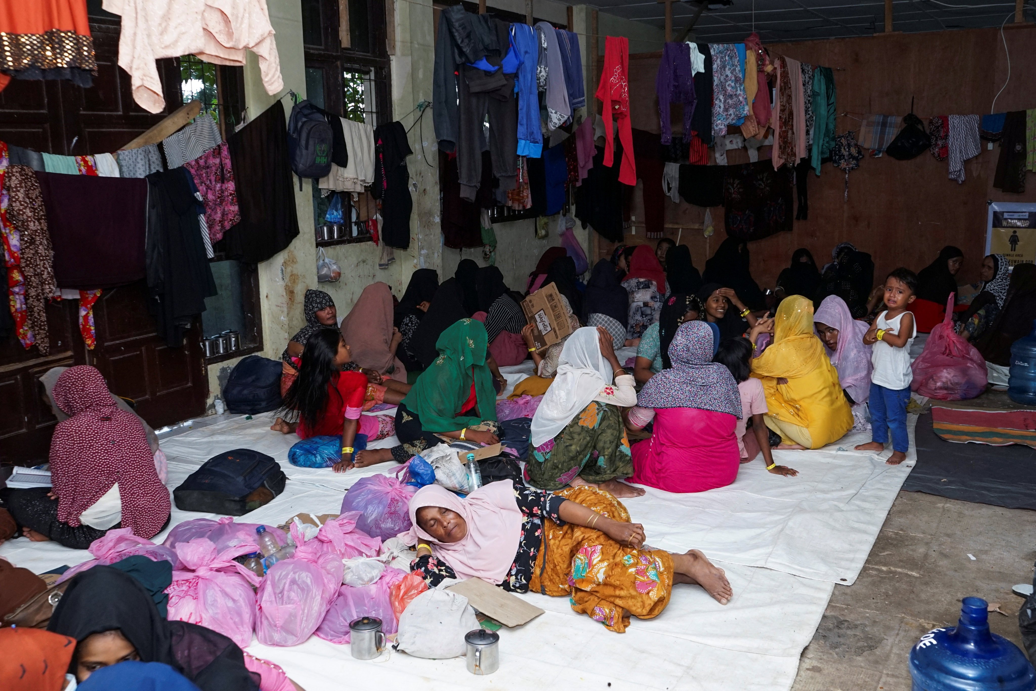 Rohingya Muslim refugees rest at an immigration building used as a temporary shelter in Lhokseumawe, Aceh province, Indonesia, on Friday. Photo: Reuters