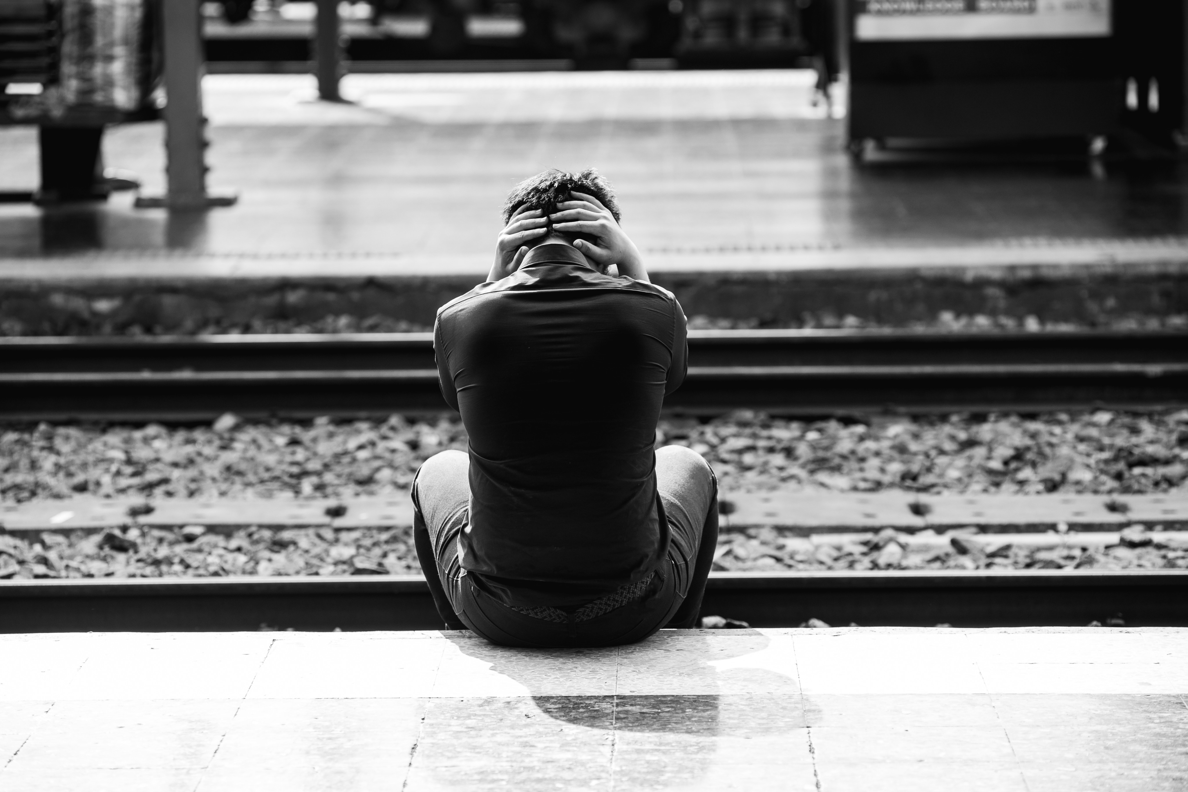 Depressed young man holding his head in hand at train station. Around 458,000 people were killed intentionally, higher than the 400,000 to 450,000 recorded every year since researchers started collating the data in 2000, according to the UN report. Photo: Shutterstock