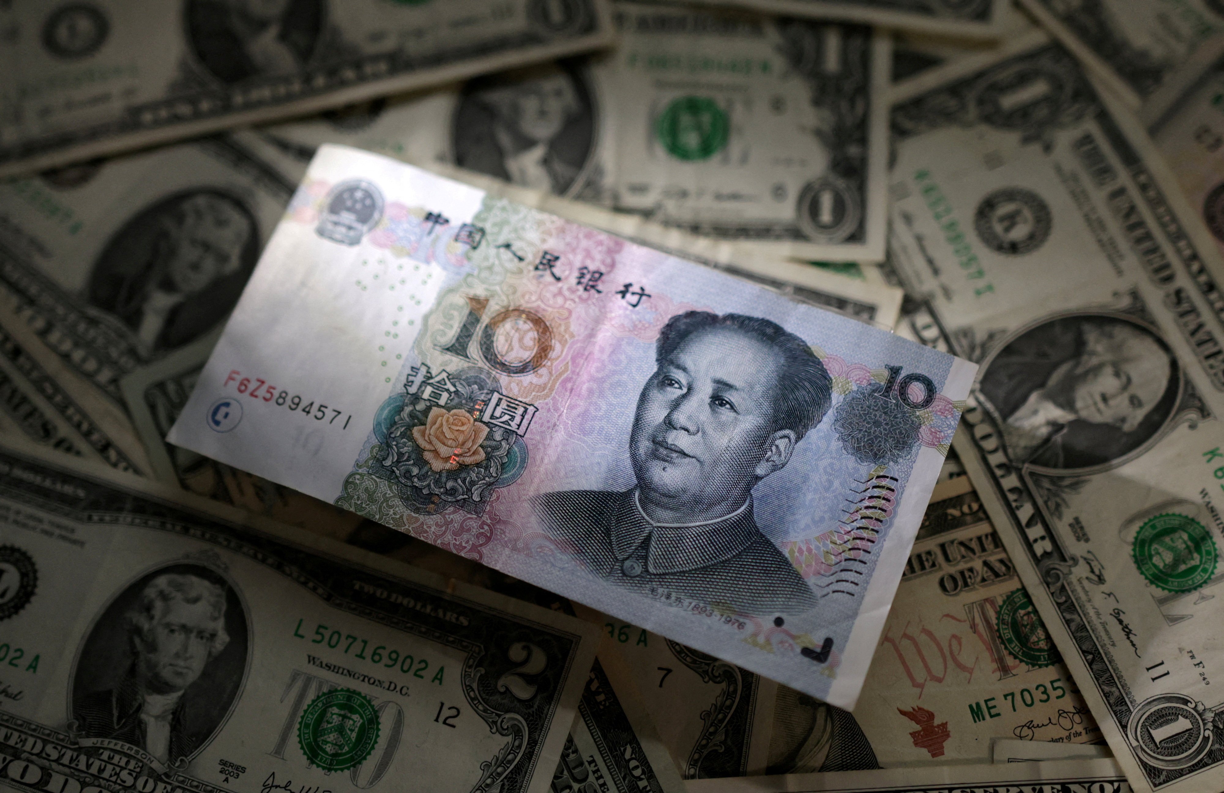 Some economists say the yuan’s exchange rate against the US dollar could remain around 7.3 to 7.5 by the end of next year. Photo: Reuters