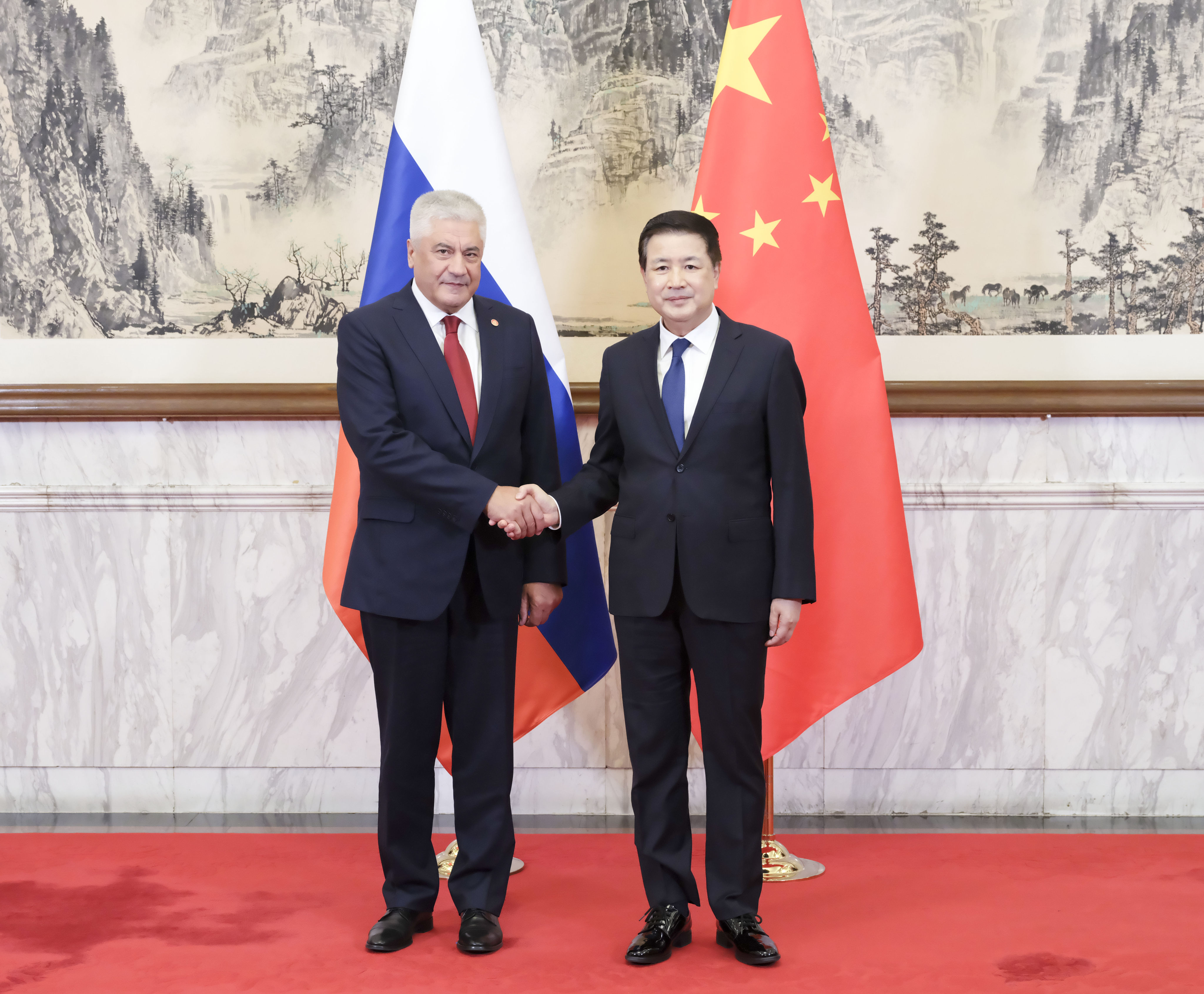 Chinese Minister of Public Security Wang Xiaohong (right) shakes hands with Russia’s Minister of Internal Affairs Vladimir Kolokoltsev in Beijing on Tuesday. Photo: Xinhua