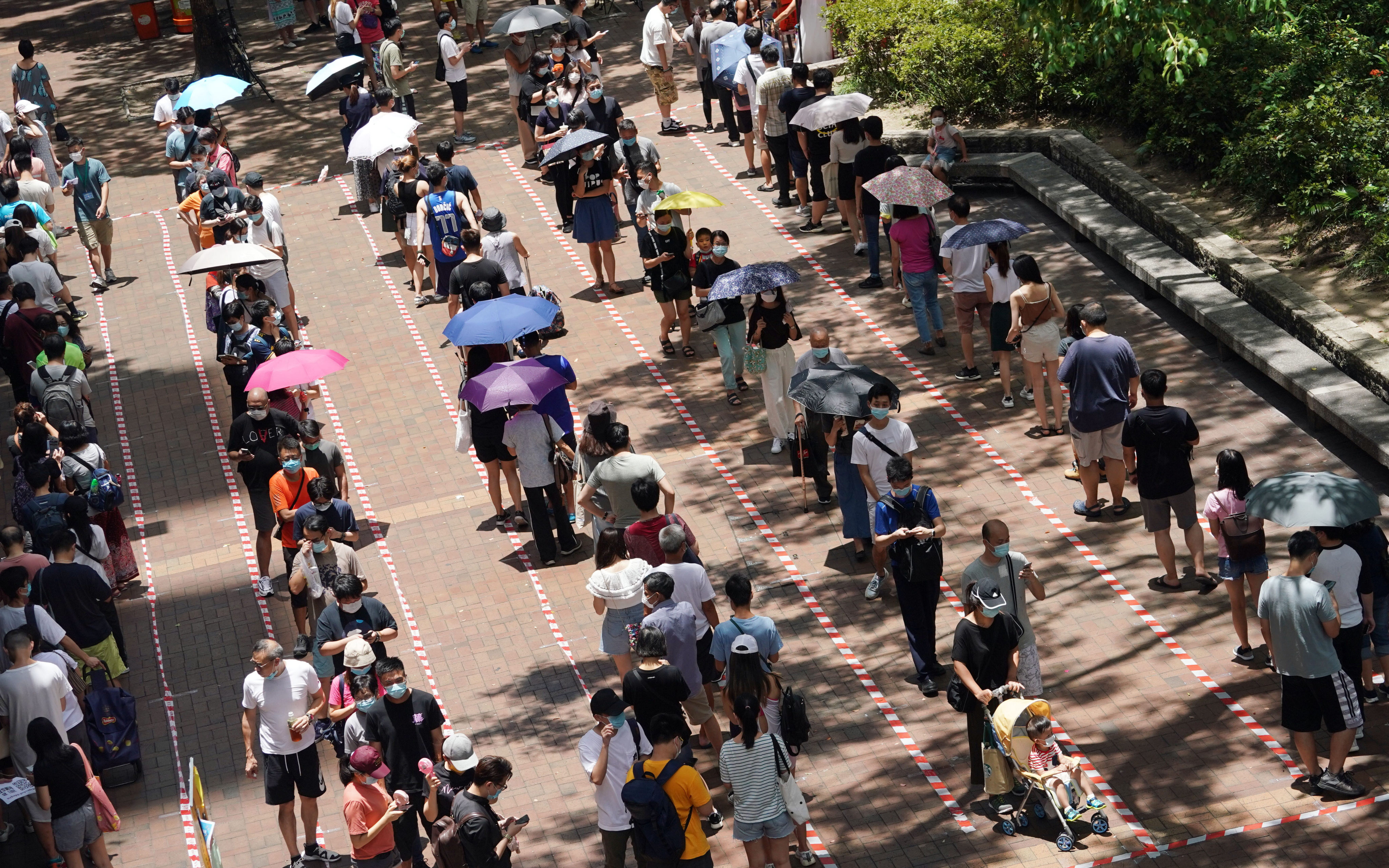 Residents line up to vote in the primary election in Tai Po in July 2020. Prosecutors have argued the defendants conspired to win control of Legco and paralyse the government. Photo: Felix Wong