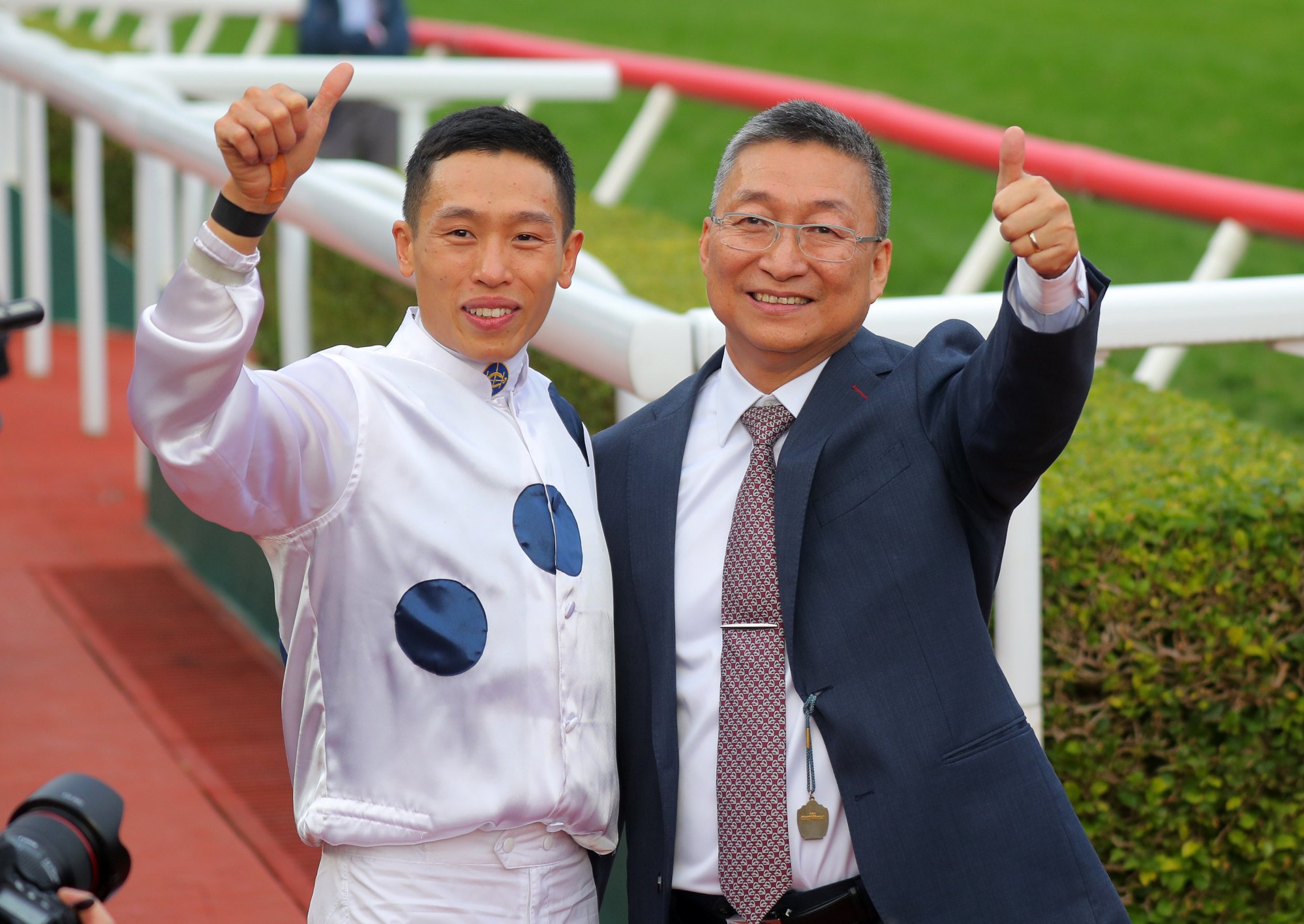 Jockey Vincent Ho and trainer Francis Lui enjoy Golden Sixty’s victory.