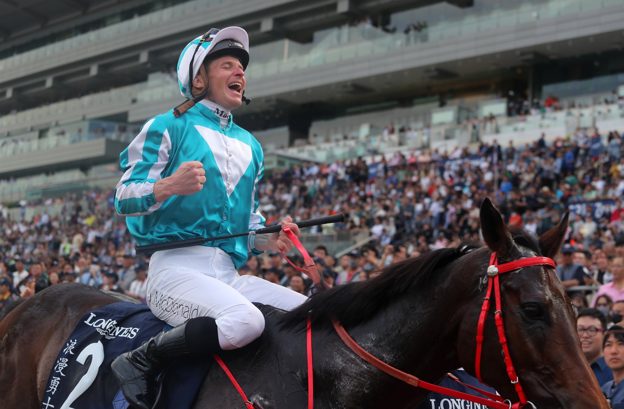 James McDonald celebrates Romantic Warrior’s second Group One Longines Hong Kong Cup (2,000m) victory.