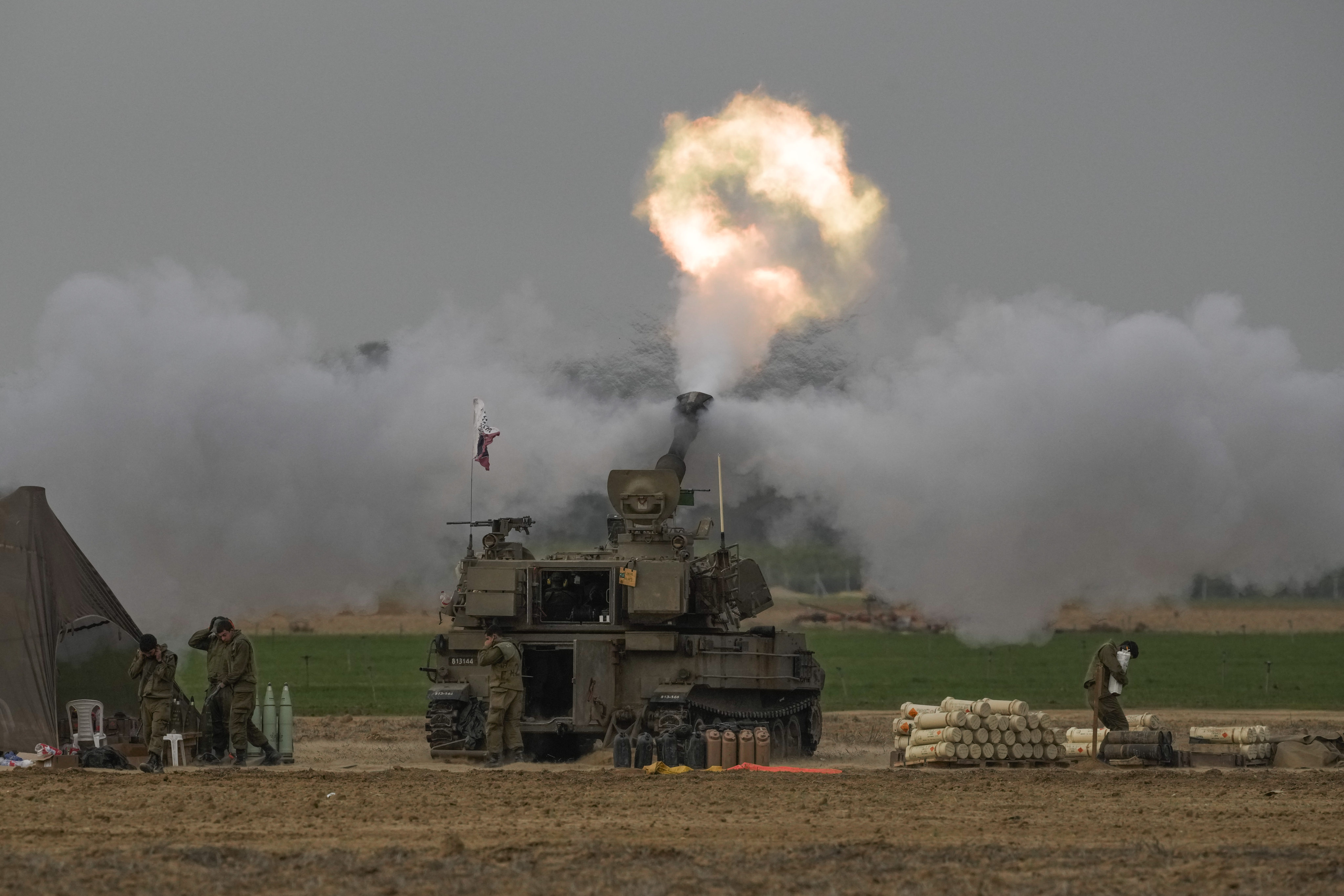 An Israeli mobile artillery unit fires a shell from southern Israel towards the Gaza Strip. Photo: AP