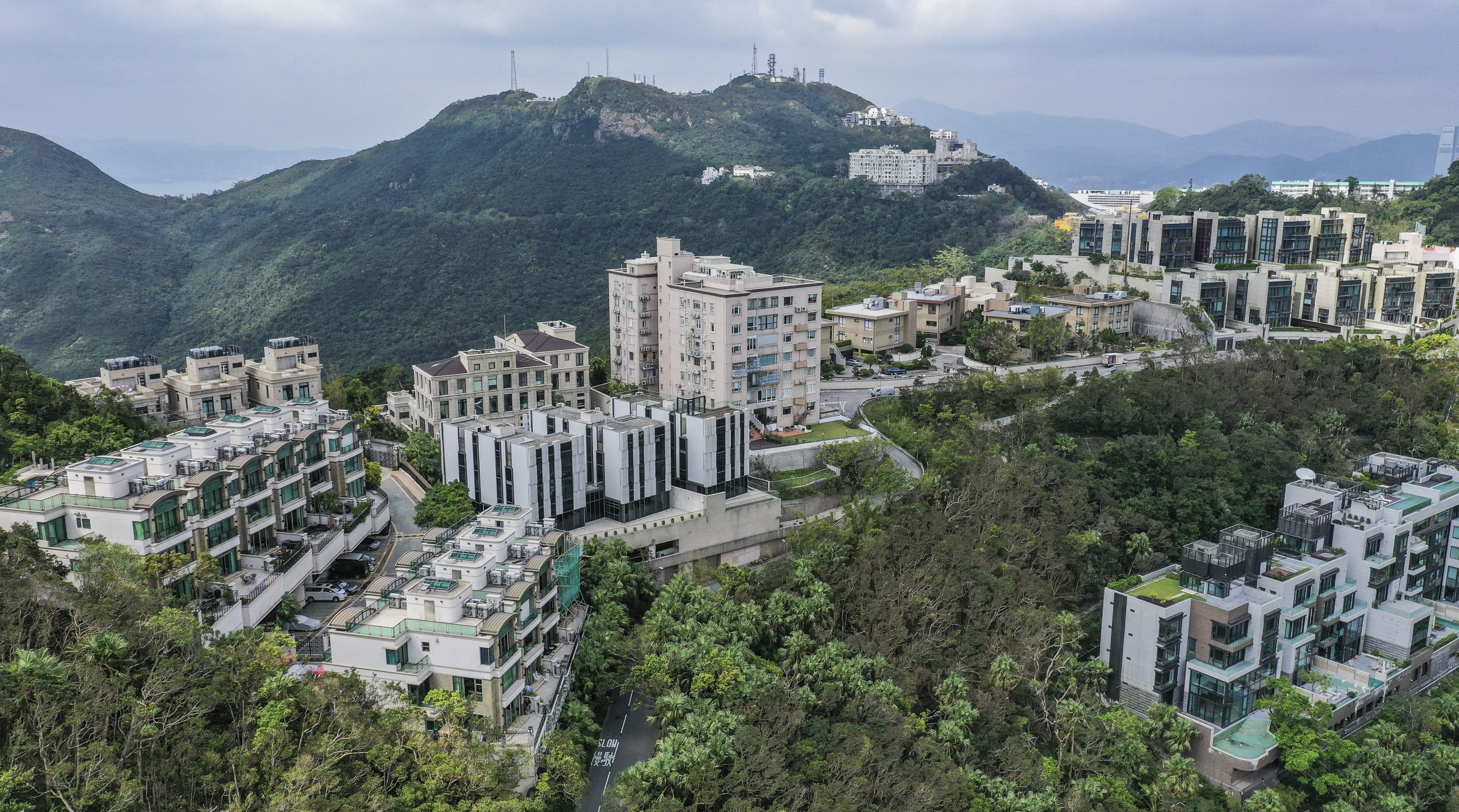 Luxury homes and residential buildings on Mount Kellett Road, The Peak. Prime property prices in Hong Kong are set to rise more than anticipated next year, according to Knight Frank. Photo: Roy Issa