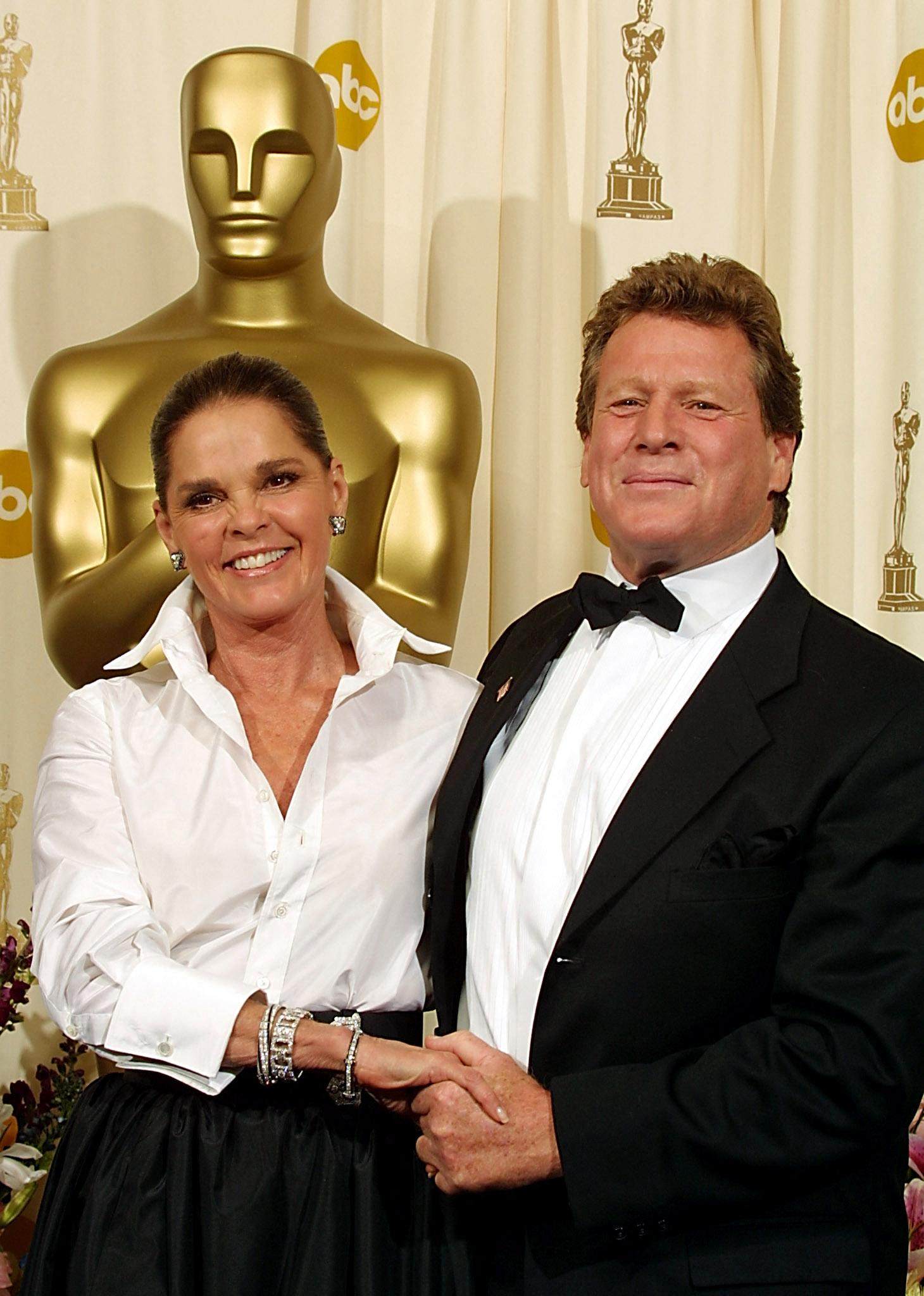 Ryan O’Neal, right, and Ali MacGraw,, stars of the 1970 film Love Story, at the Oscars in 2002. O’Neal died on Friday. Photo: AFP