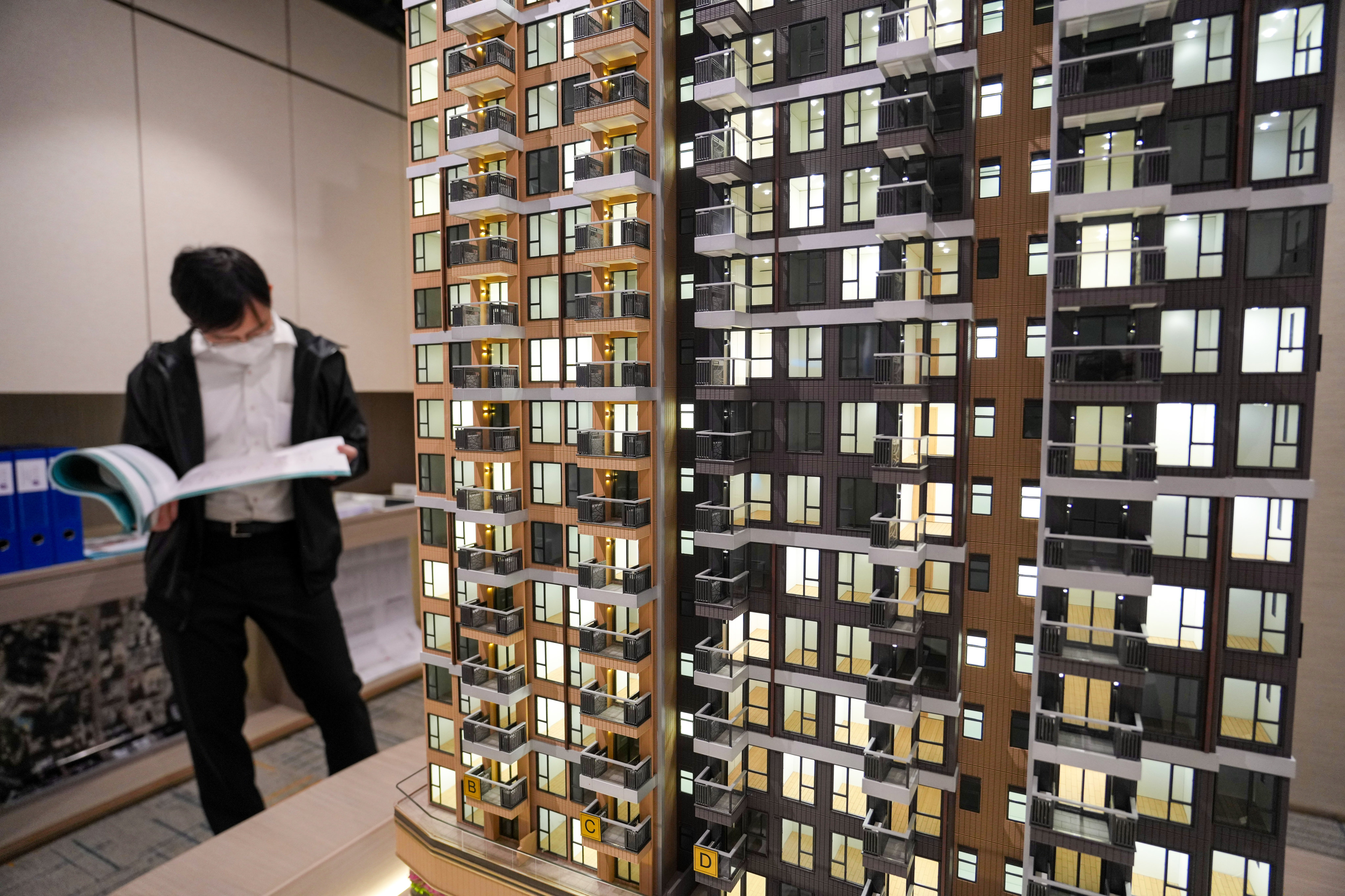 People visit the show flat the eResidence Tower 3,  a Starter Homes (SH) Project for Hong Kong Residents developed by Urban Renewal Authority in Hung Hom, at a sales office at The Harmonie at Cheung Sha Wan. Photo: Sam Tsang