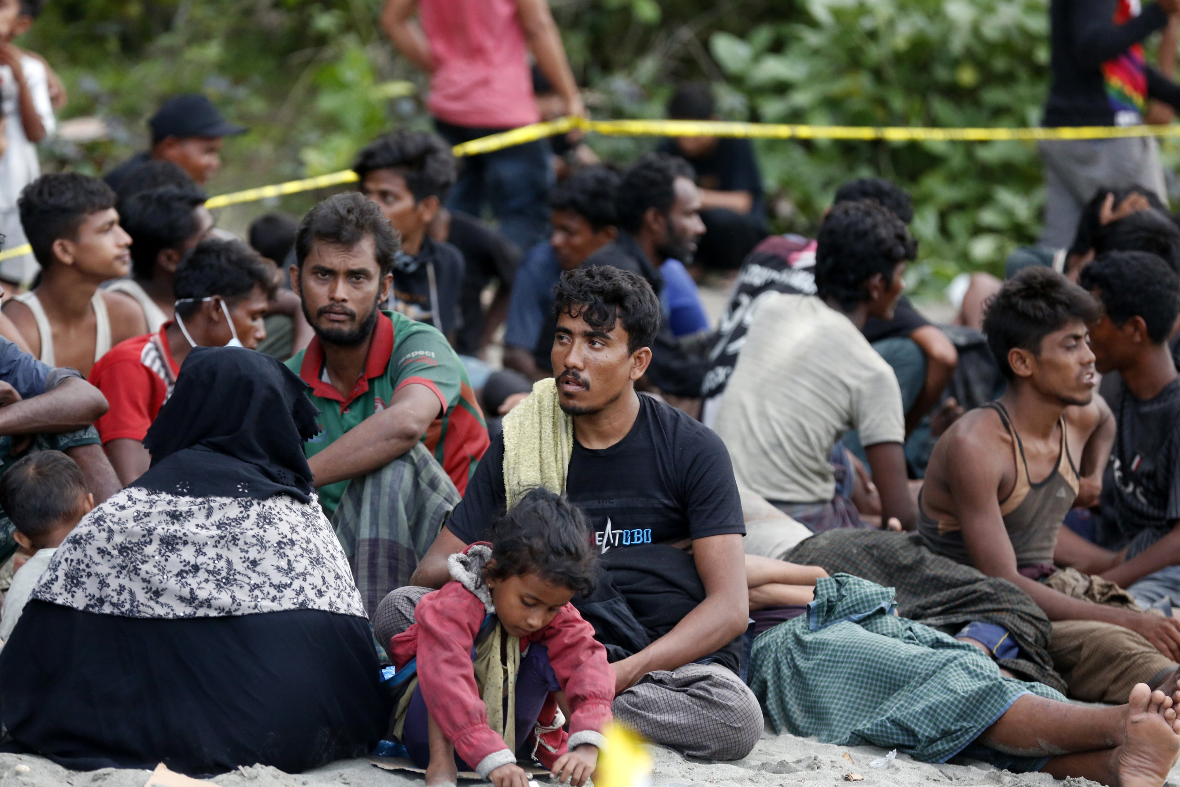 Rohingya refugees rest in an open area after landing on a beach at Pidie, Aceh. Photo: EPA-EFE