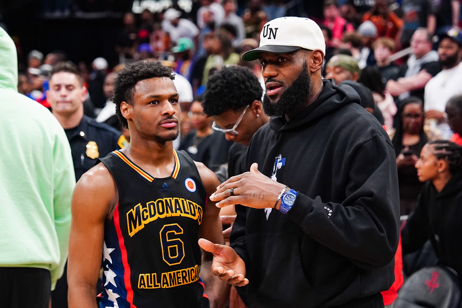 Bronny James talks to LeBron James of the Los Angeles Lakers after the 2023 McDonalds High School Boys All-American Game at Toyota Center on March 28, in Houston, Texas. Photo: TNS