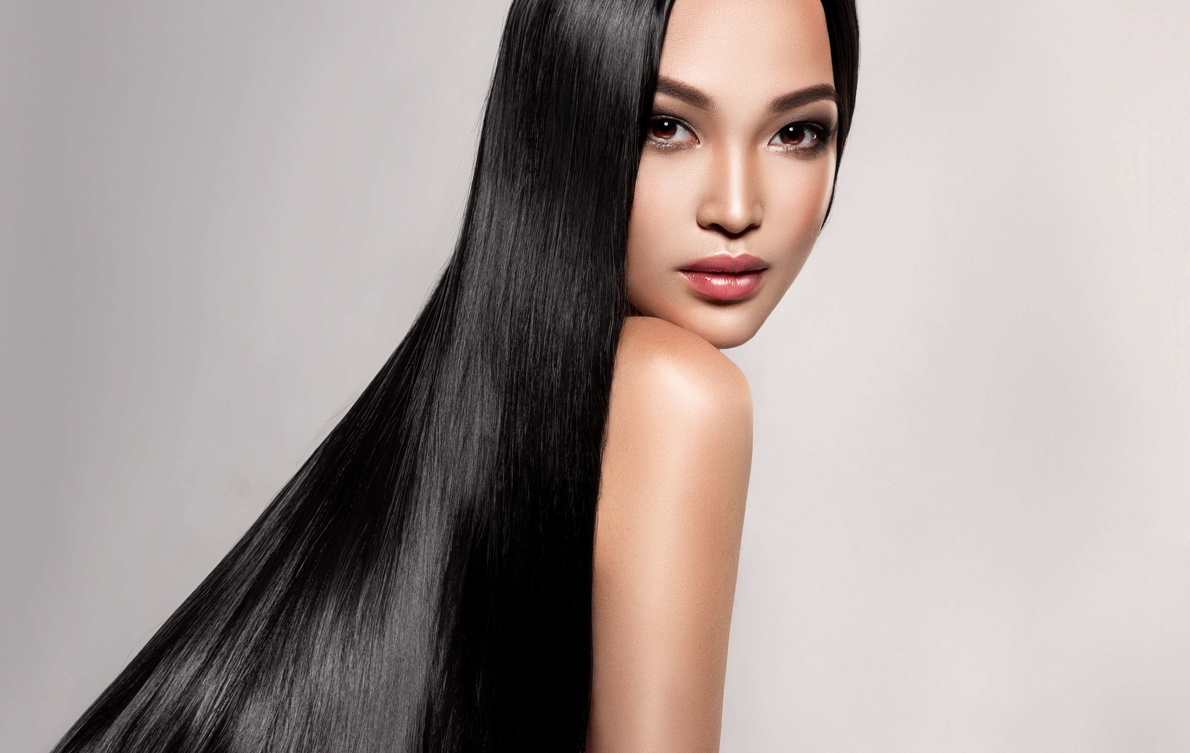 Damaging the keratin layer in your hair can result in frizzy locks, but thankfully certain products and treatments can restore straightness and smoothness. Photo: Shutterstock