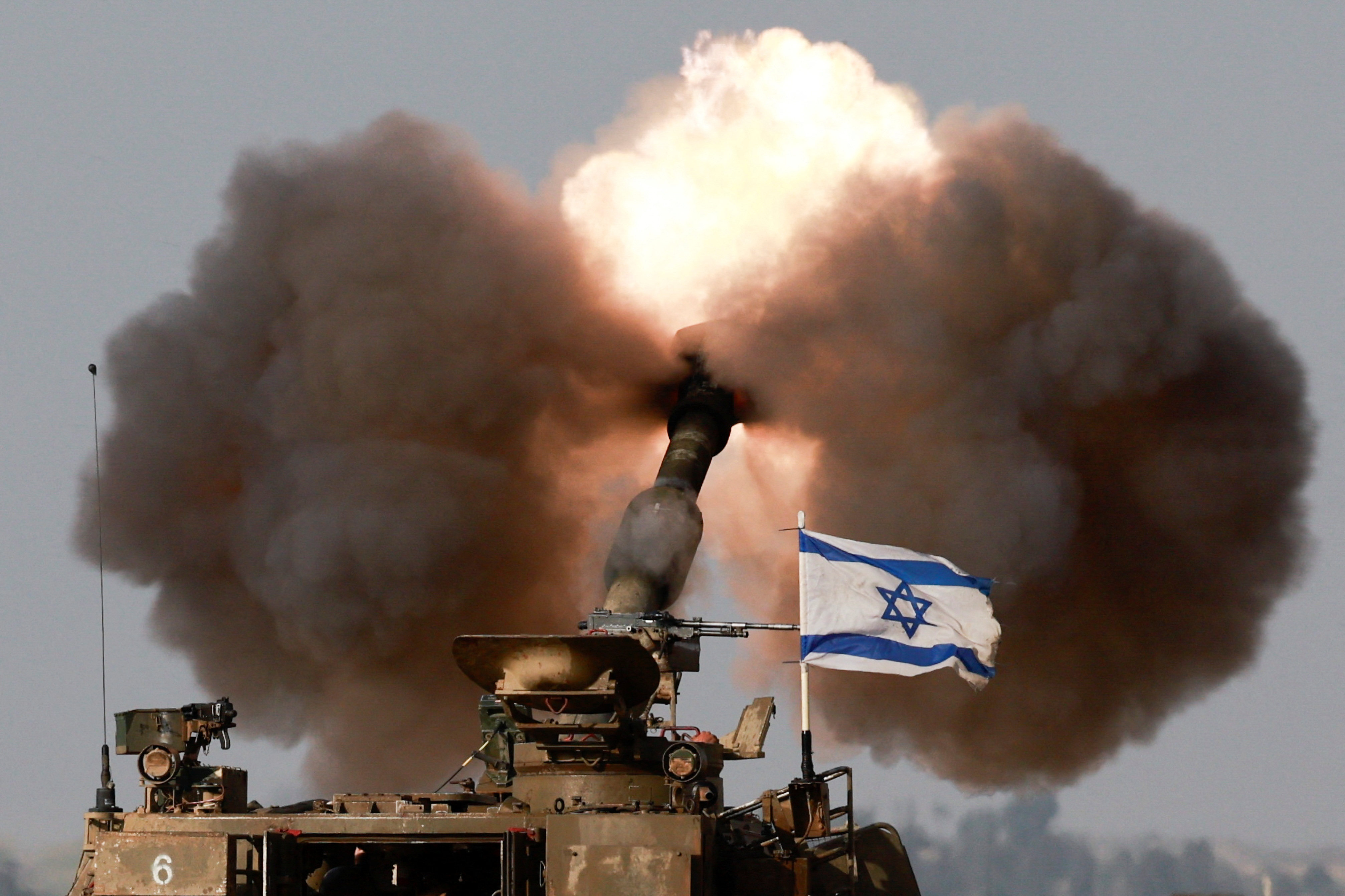 An Israeli artillery unit fires shells at Gaza from southern Israel on Tuesday. More than 17,000 people have been killed in the Palestinian territory since the war began. Photo: Reuters