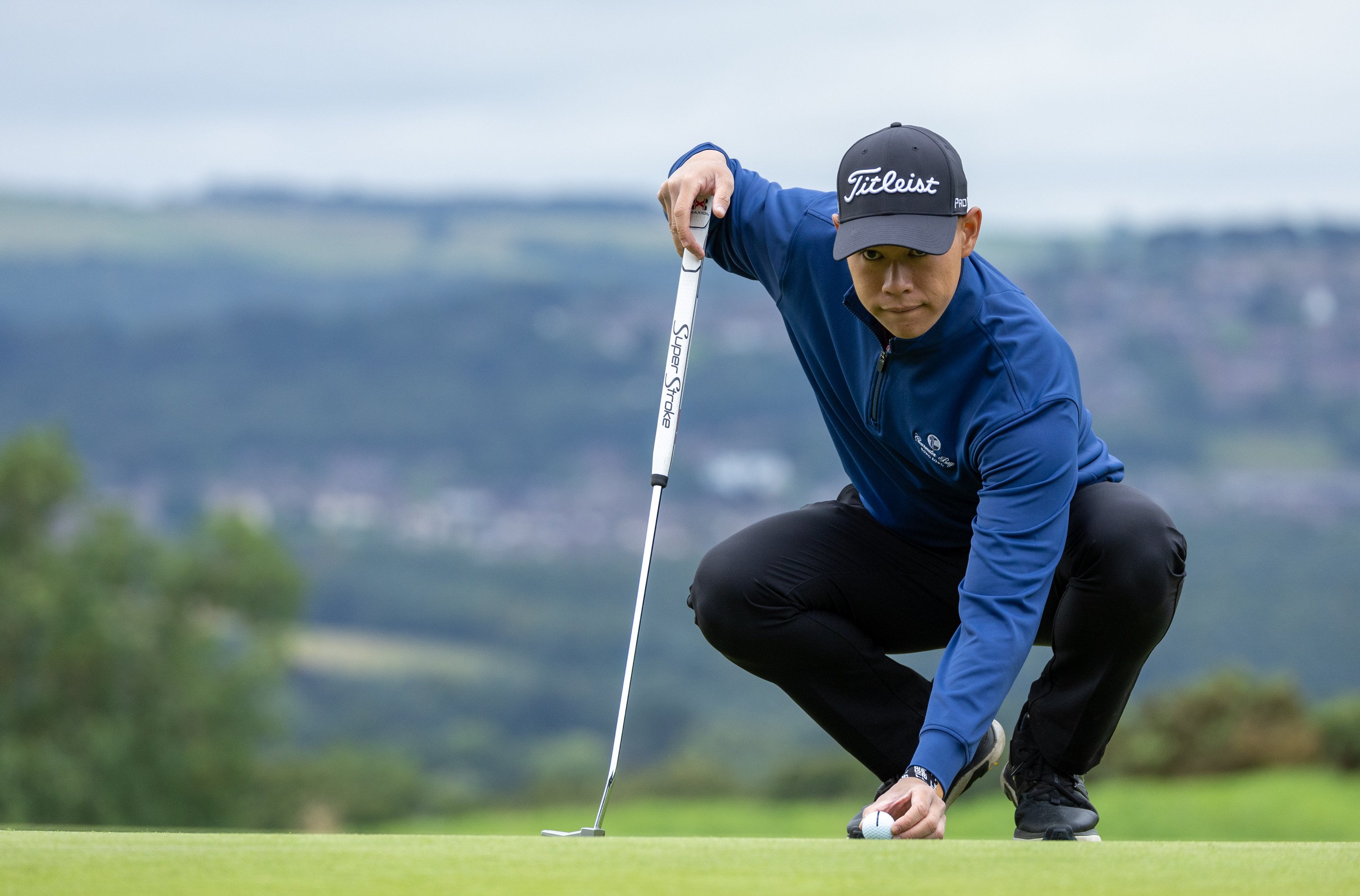 Matthew Cheung lines up a putt during the second round of the International Series England at Close House. Photo: Asian Tour