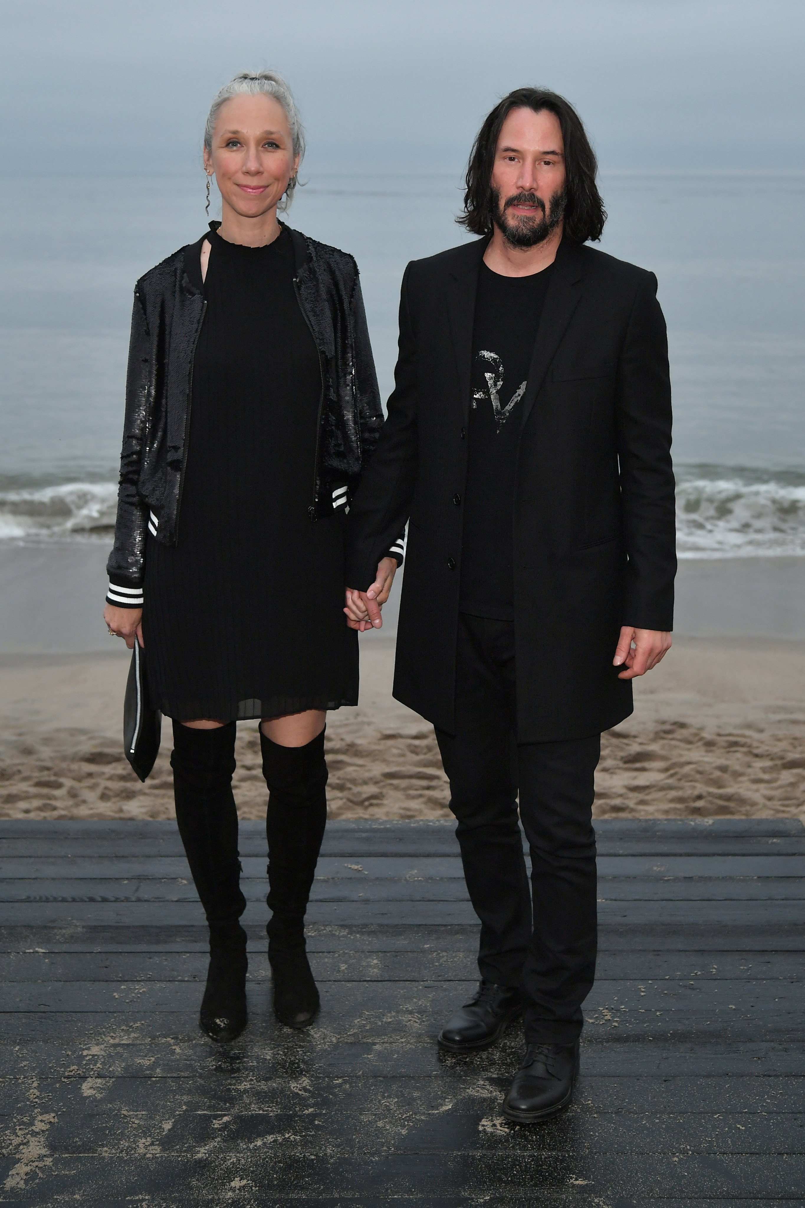 Alexandra Grant and Keanu Reeves attending Saint Laurent men’s spring/summer 2020 show in Malibu, California, in June 2019. Photo: Getty Images