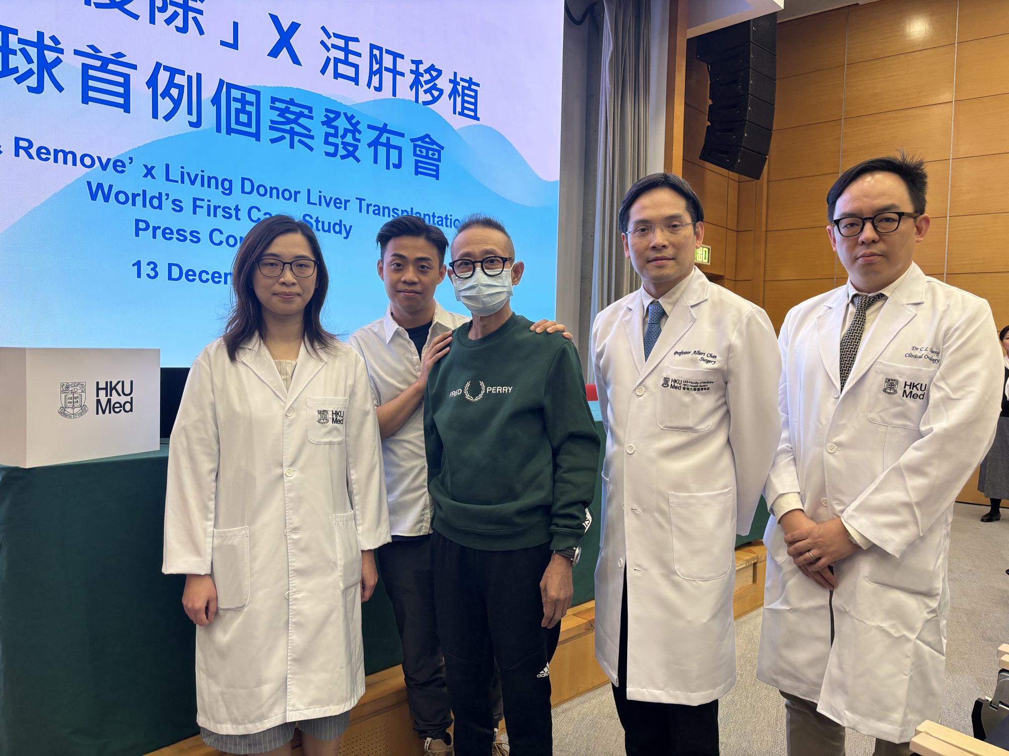 The HKU research team with Wong Lok-wing (centre) who was cured of late-stage liver cancer. Photo: Connor Mycroft