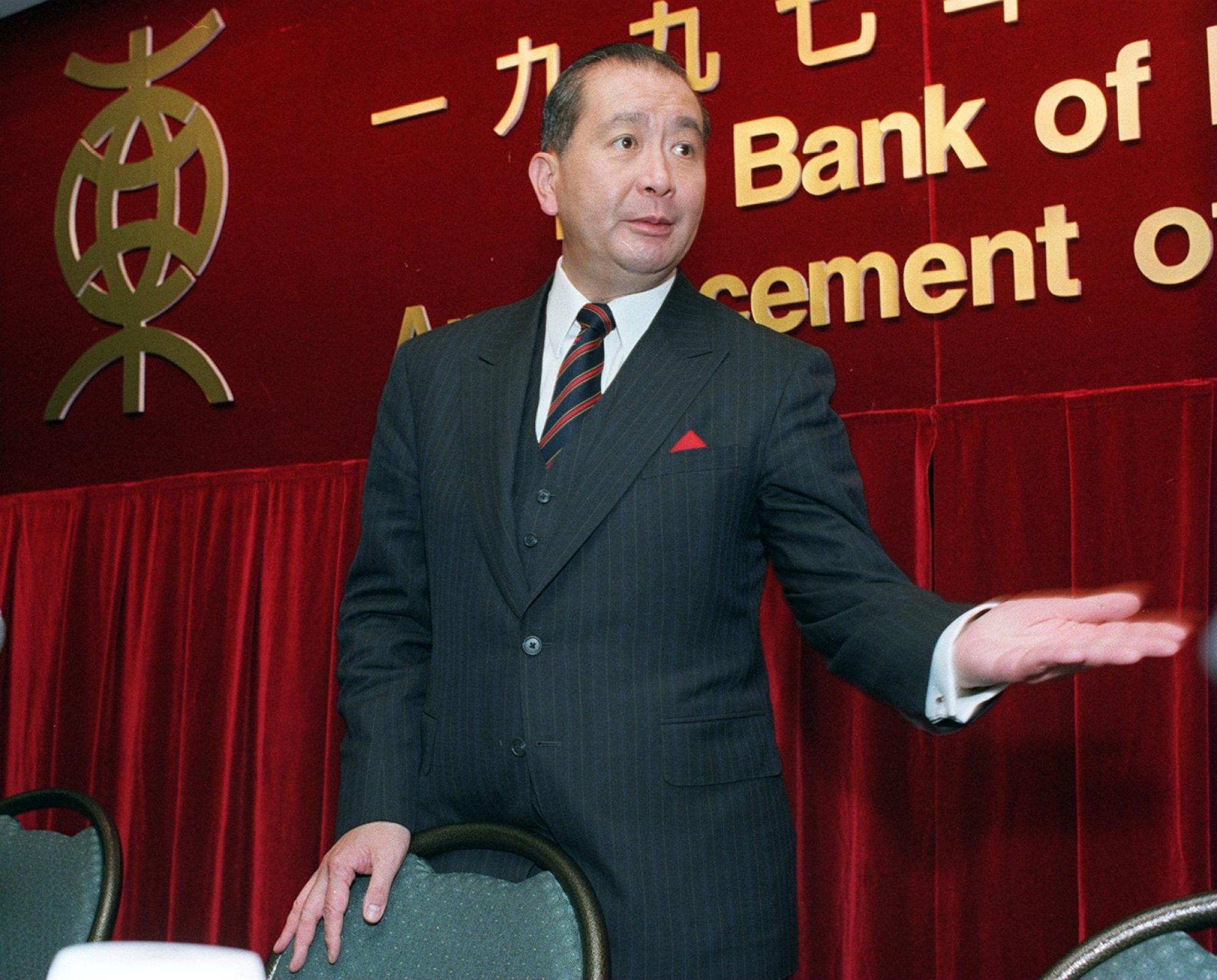 David Kwok-Po Li, the former chief executive of Bank of East Asia, with the pre-2002 version of the bank’s logo in the background, during a press event on August 1, 1997 in Hong Kong. Photo: Wong Sik-chiu.