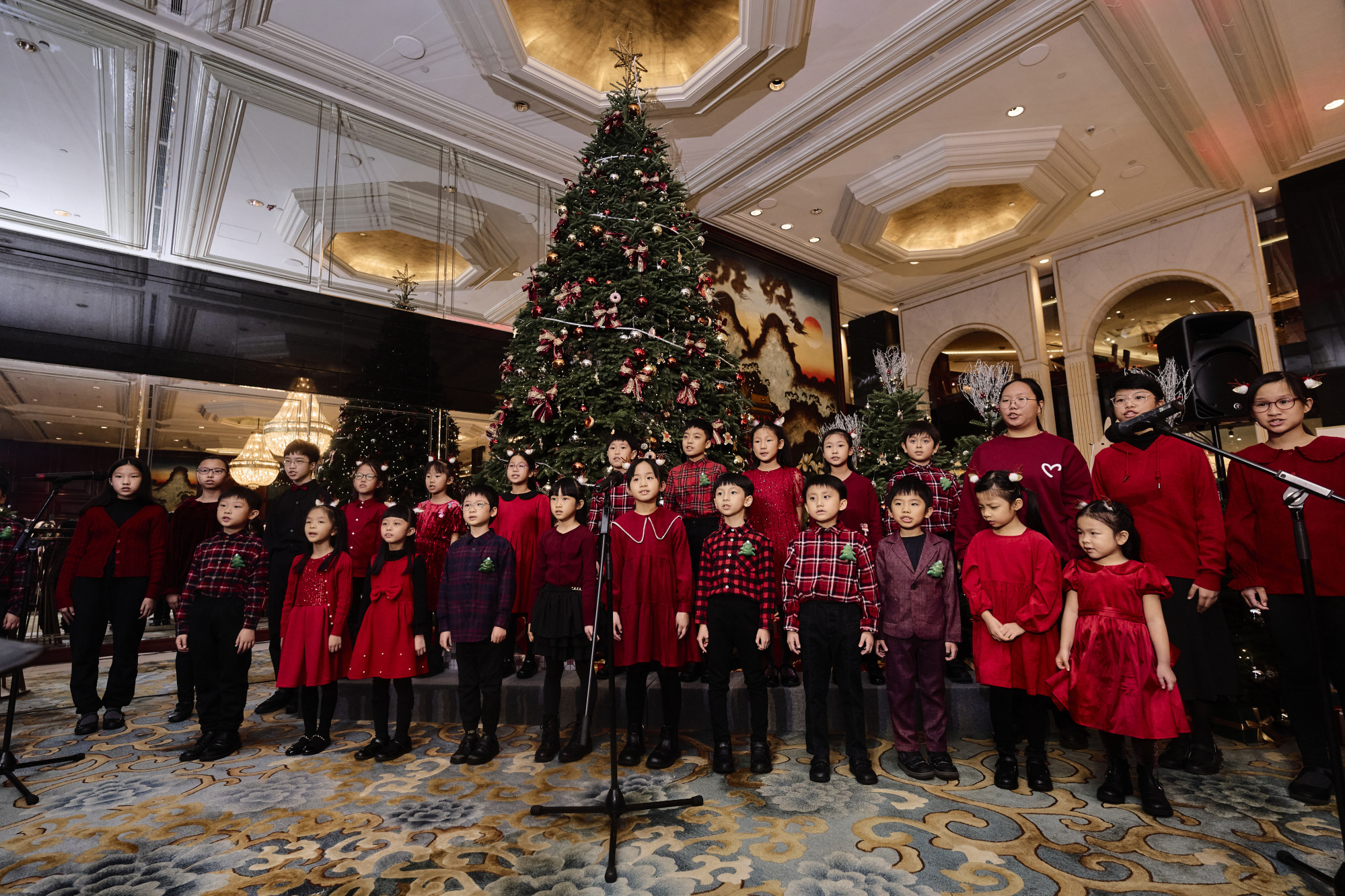 SWAN Academy Children’s Choir entertains guests with festive songs at the Christmas tree lighting ceremony. Photo: Handout