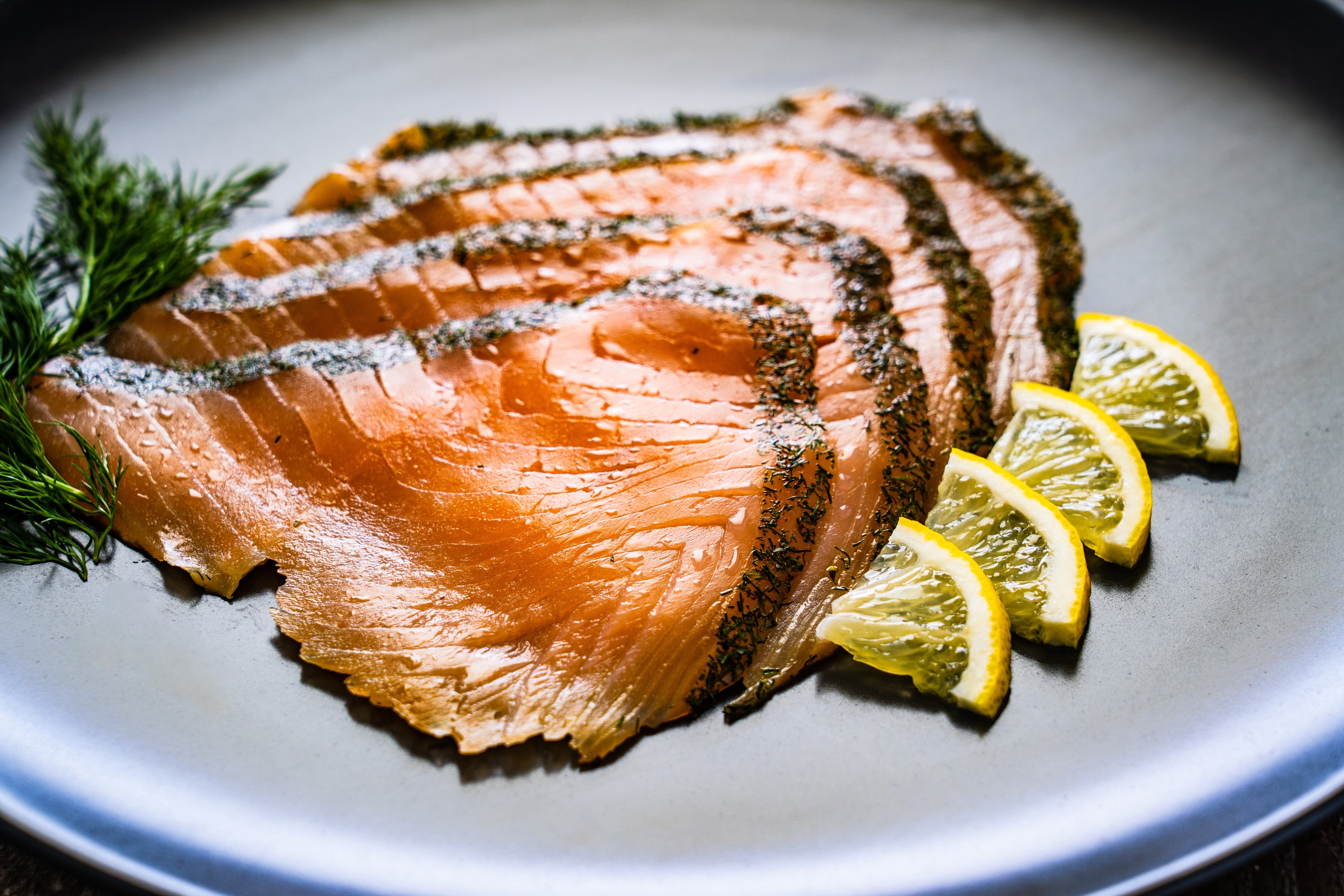 Smoked salmon with dill and lemon. Not all smoked salmon is cooked, and that means it needs handling with care and that some people should avoid eating it, according to food safety experts. Photo: Shutterstock