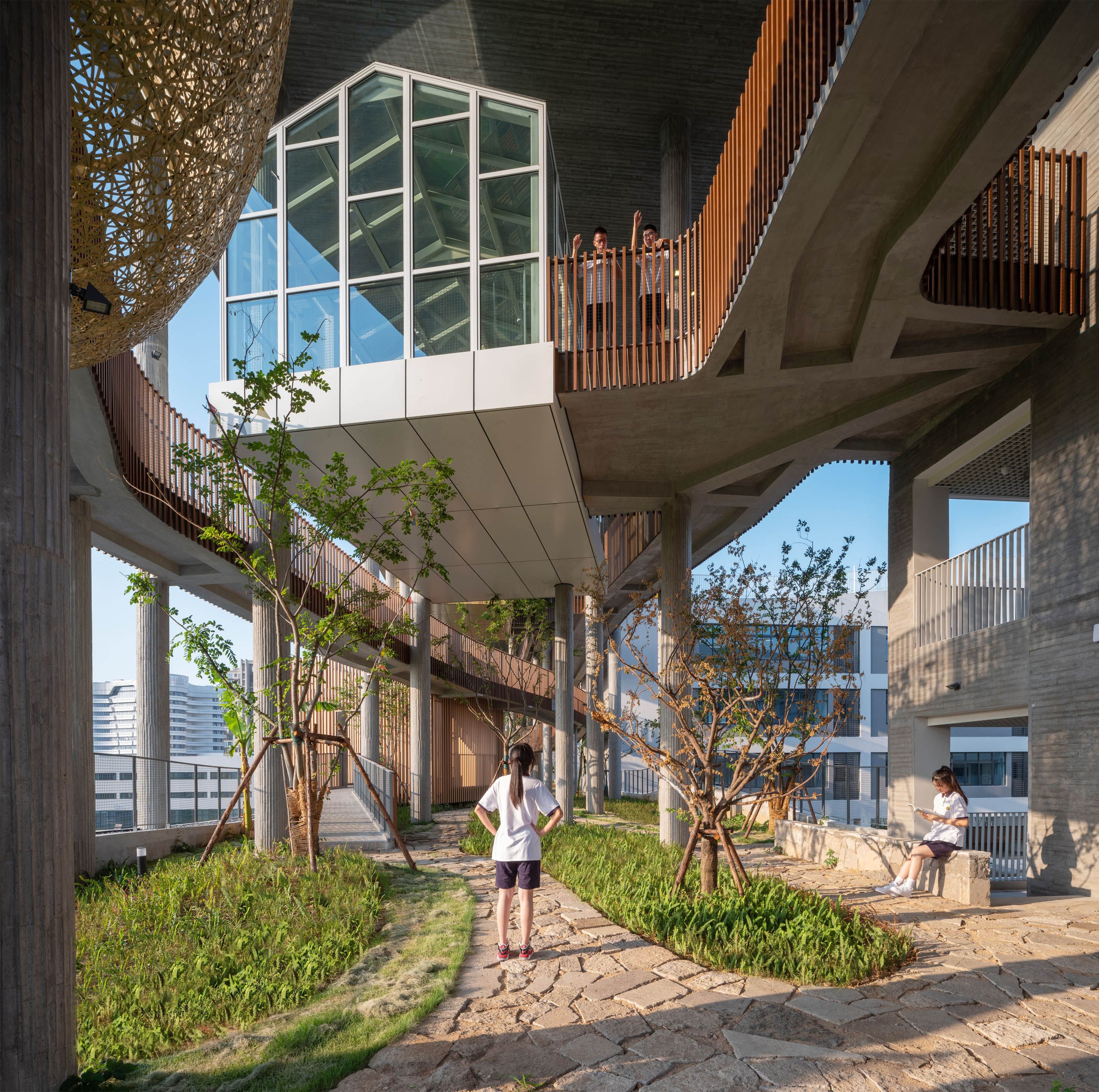 At Huizhen High School, in Ningbo, China - the World Building of the Year 2023 - pathways between classrooms are meandering routes that take in greenery, one of many architectural elements designed to relieve academic pressure. Photo: Courtesy of Approach Design Studio