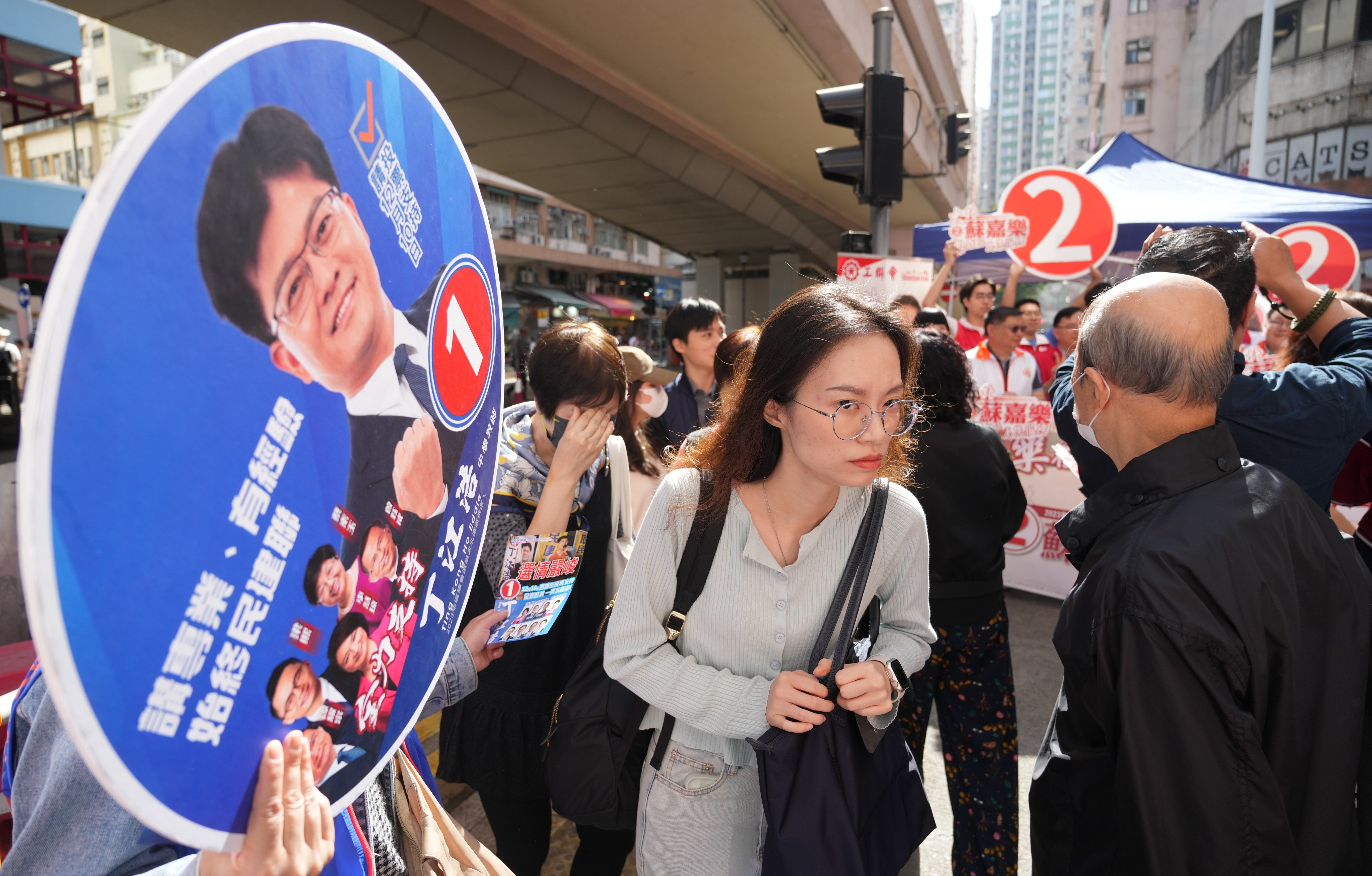 Political parties canvass voters for the district council election at North Point on December 10. Photo: Sam Tsang