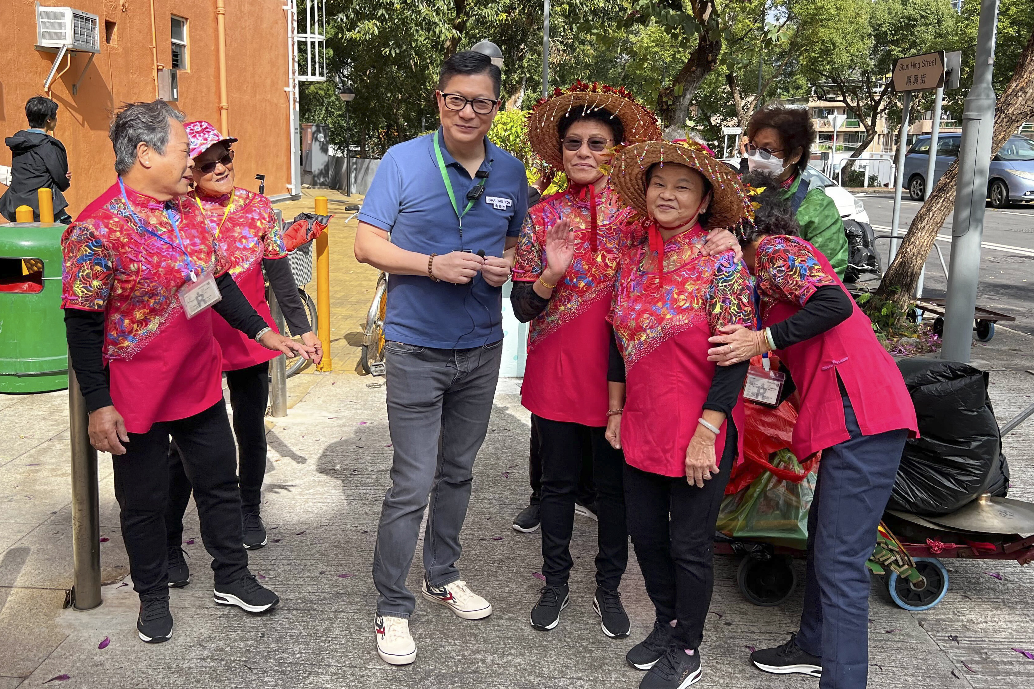 Security chief Chris Tang with Hakka women at Sha Tau Kok. The village is one of the last remaining settlements in the Frontier Closed Area, a regulated zone first established in 1951 to prevent illegal immigrants from crossing the border. Photo: Denise Tsang