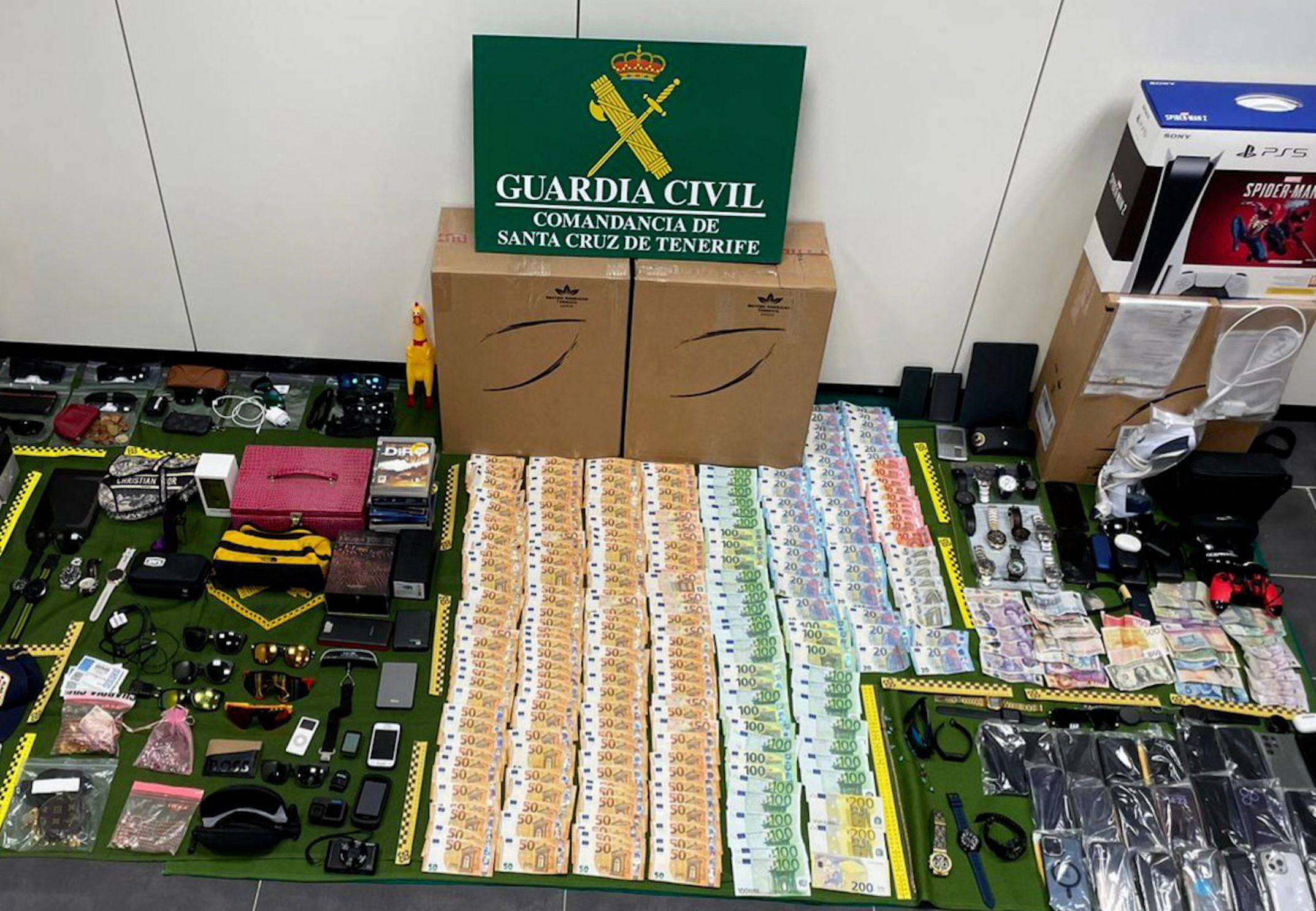Seized items allegedly stolen by employees of Tenerife Sur airport. Photo: Guardia Civil/AFP