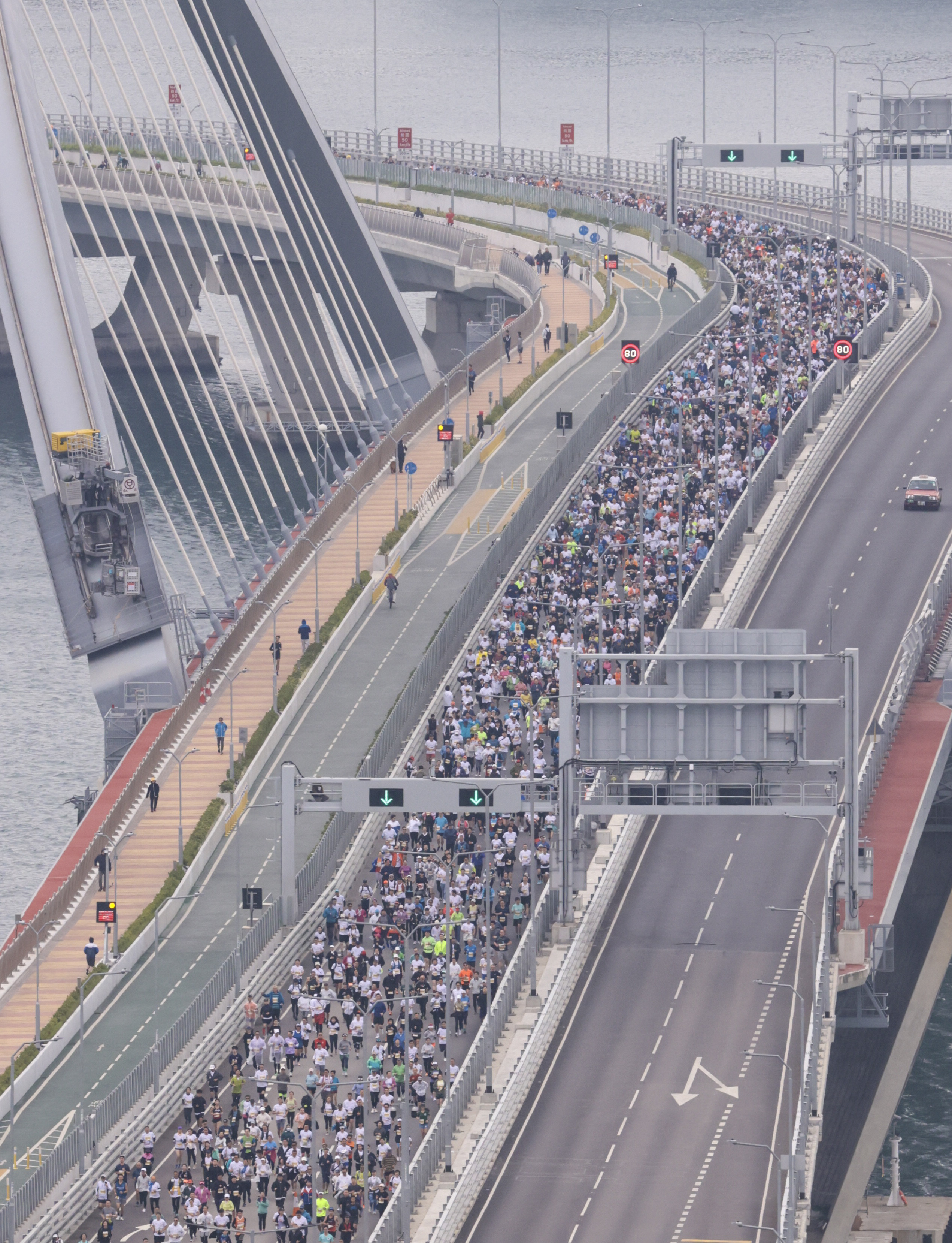 10km runners on the Tseung Kwan O Cross Bay Bridge during the Hong Kong Streetathon. Photo: May Tse