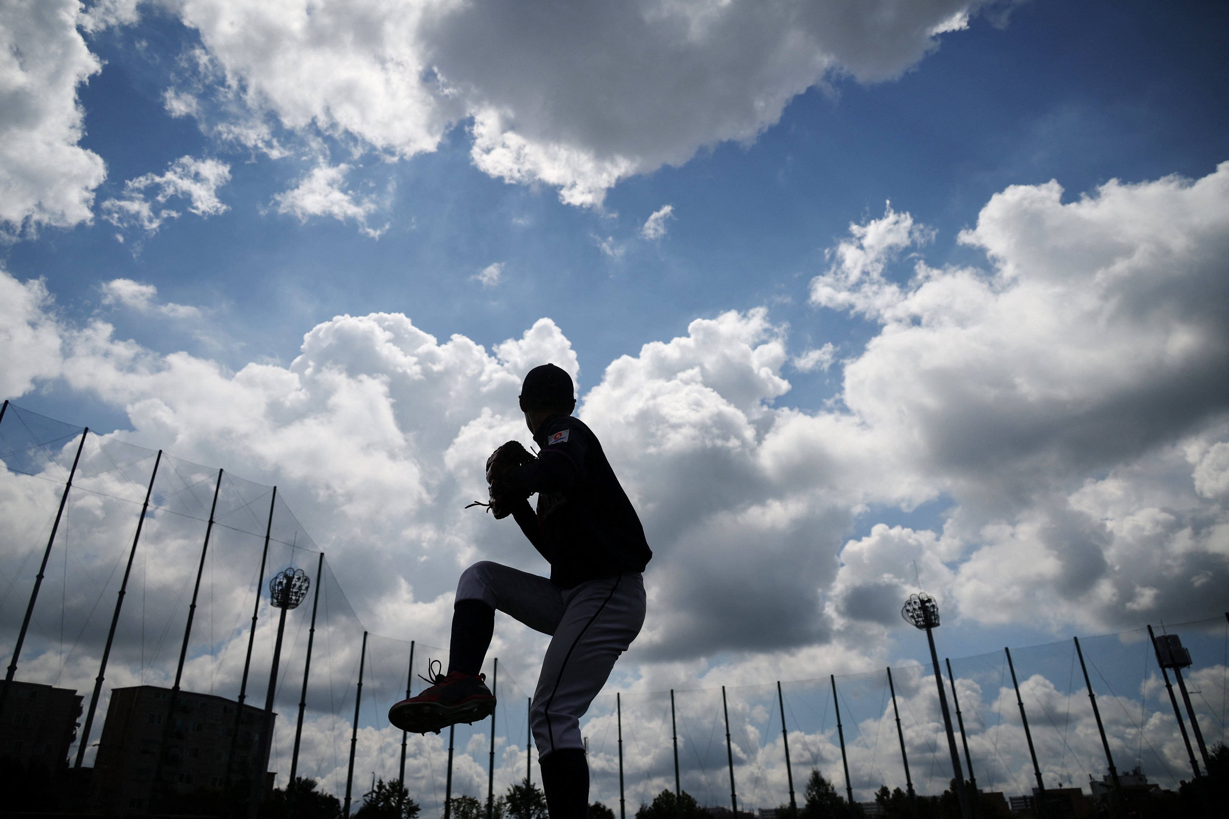 A member of the Deokjeok High School baseball team, warms up before a game. The university team has breathed life into Deokjeok, which was struggling to retain, and attract, youngsters, like many other rural areas in the world’s most rapidly ageing society. Photo: Reuters