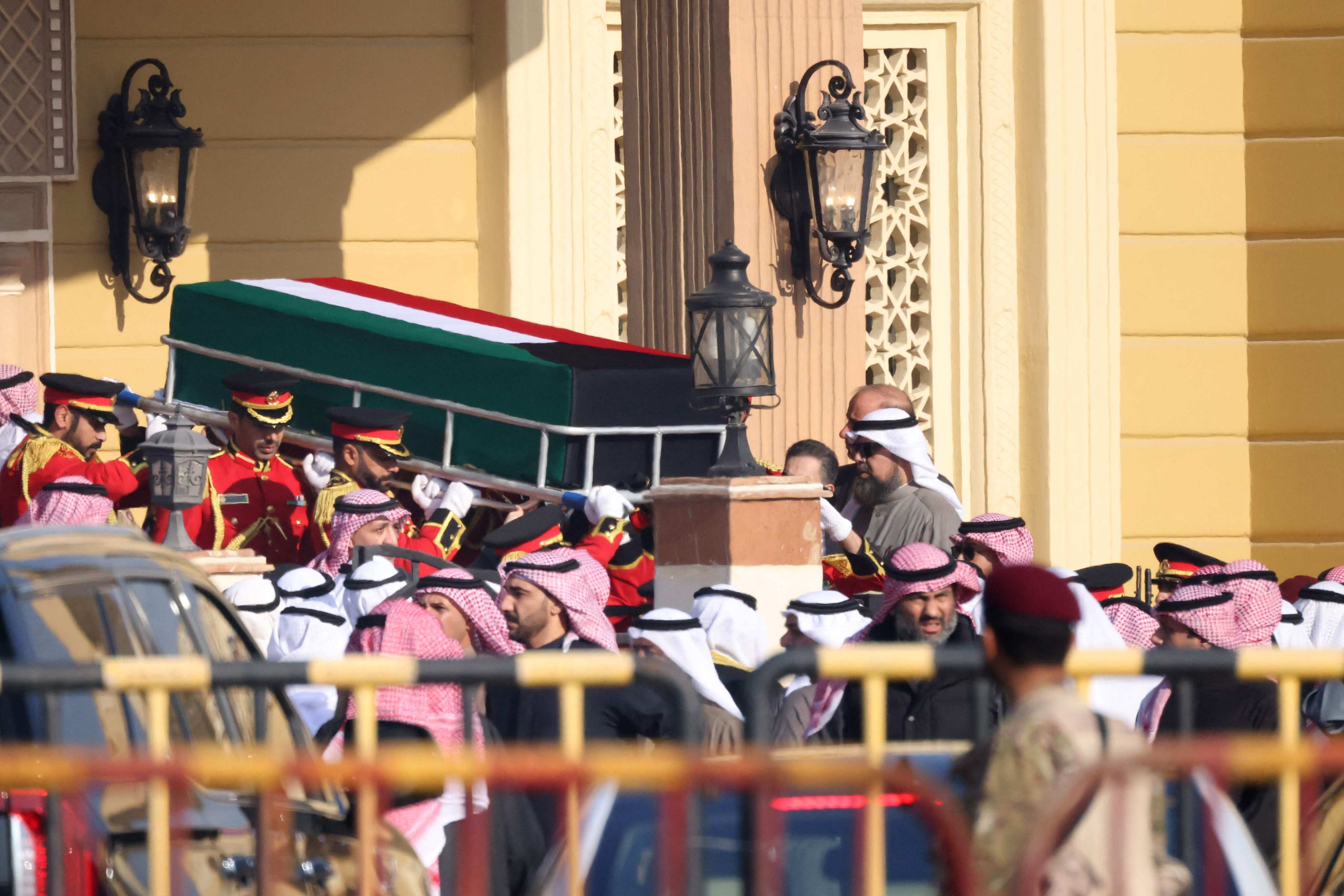 The coffin of Kuwait’s late Emir Sheikh Nawaf al-Ahmad al-Sabah is carried out of the Bilal bin Rabah Mosque in Kuwait City on Sunday. Photo: AFP