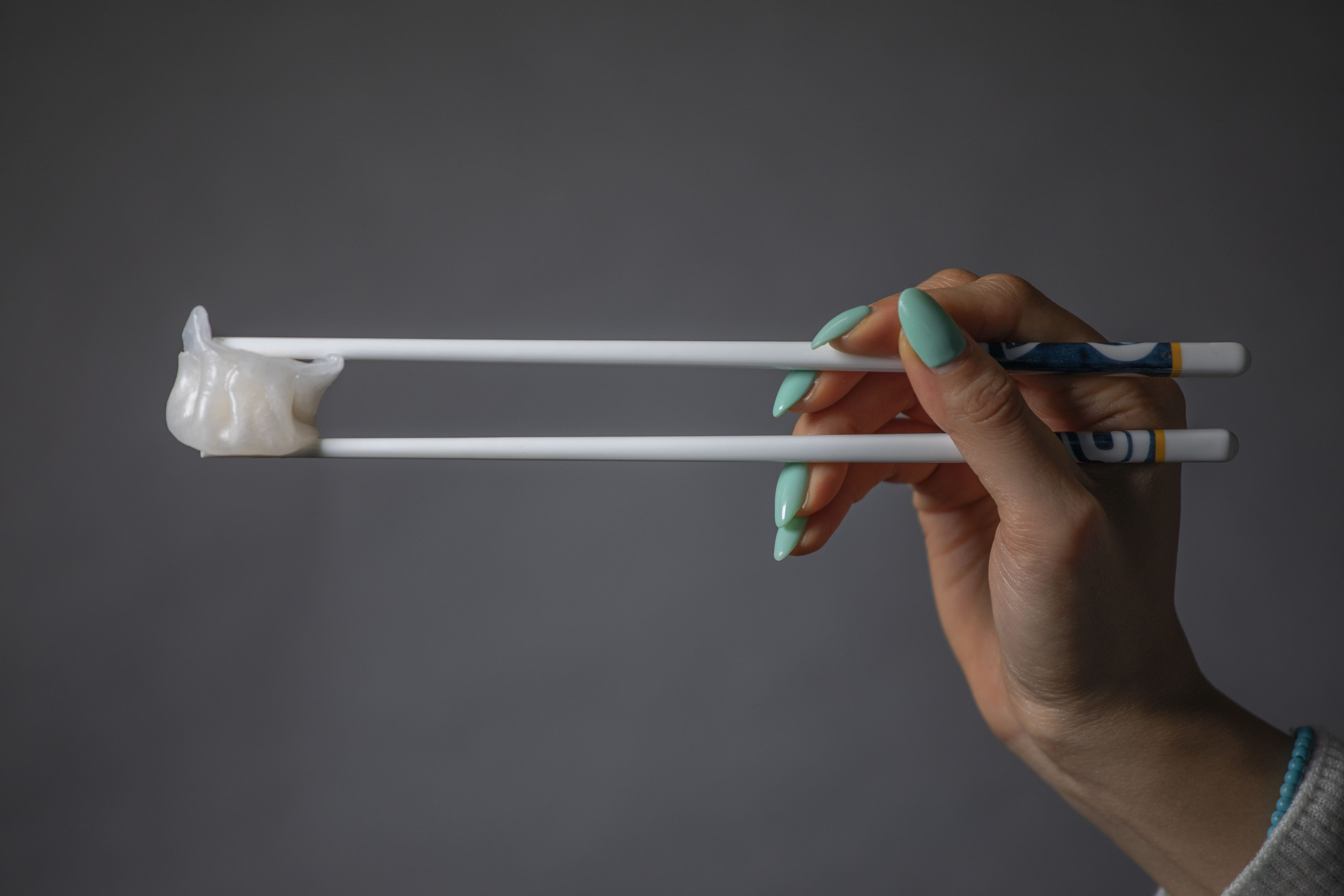 The correct way to hold chopsticks - Post writer Erika Na demonstrates how to eat with them. Photo: Antony Dickson