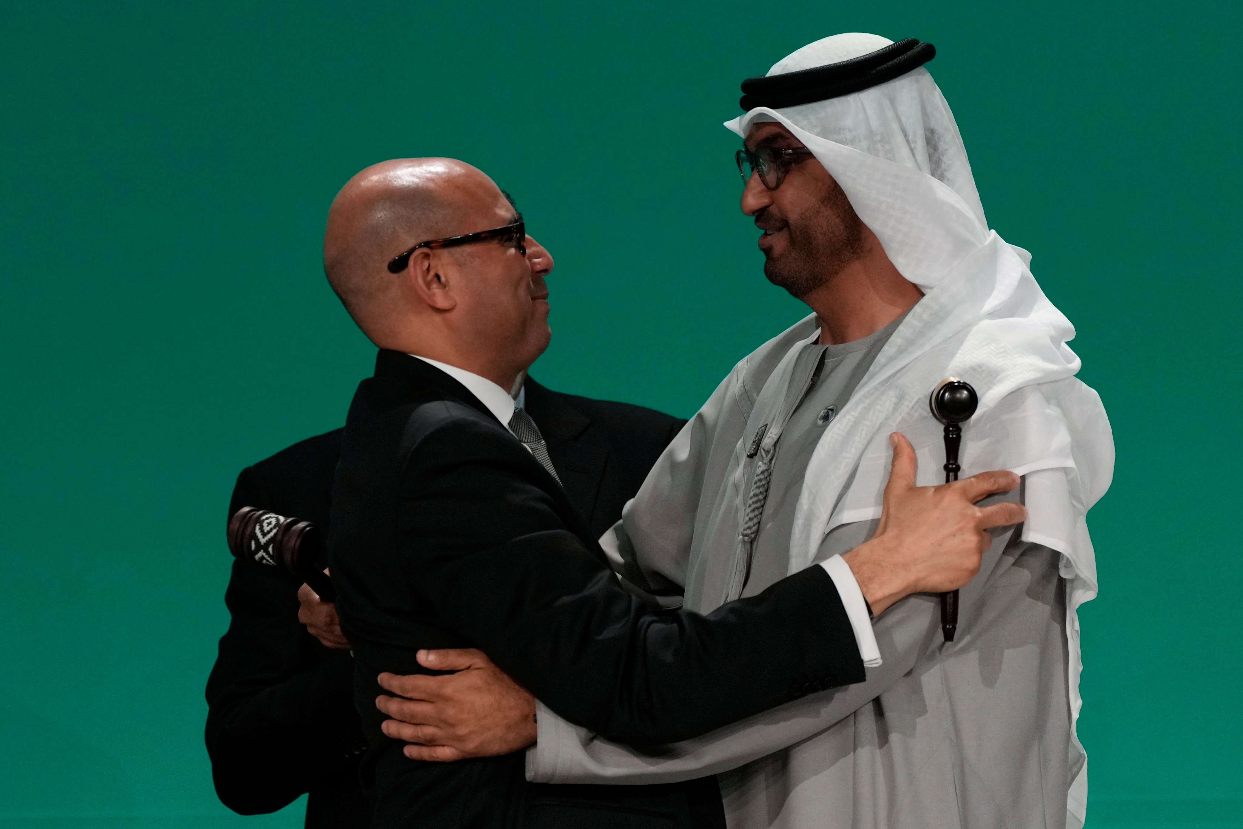 United Nations climate chief Simon Stiell embraces Cop28 president Sultan al-Jaber after the final gavel at the UN climate summit on December 13 in Dubai. Photo: AP 