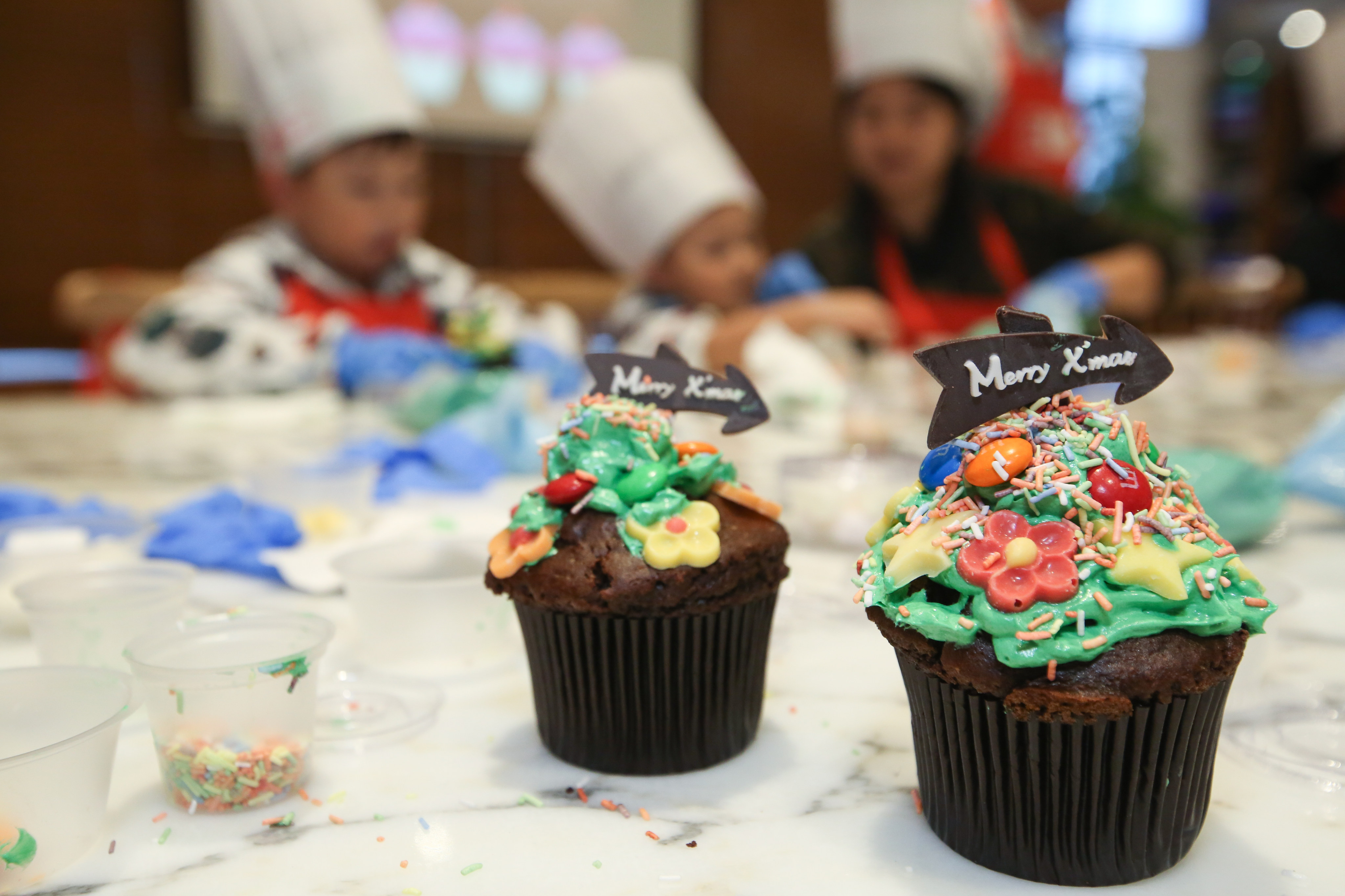 Cup cakes decorated with Christmas greetings. A previous directive had prevented bakeries in Malaysia with halal certificates from putting food items with festive greetings on display. Photo: Edmond So