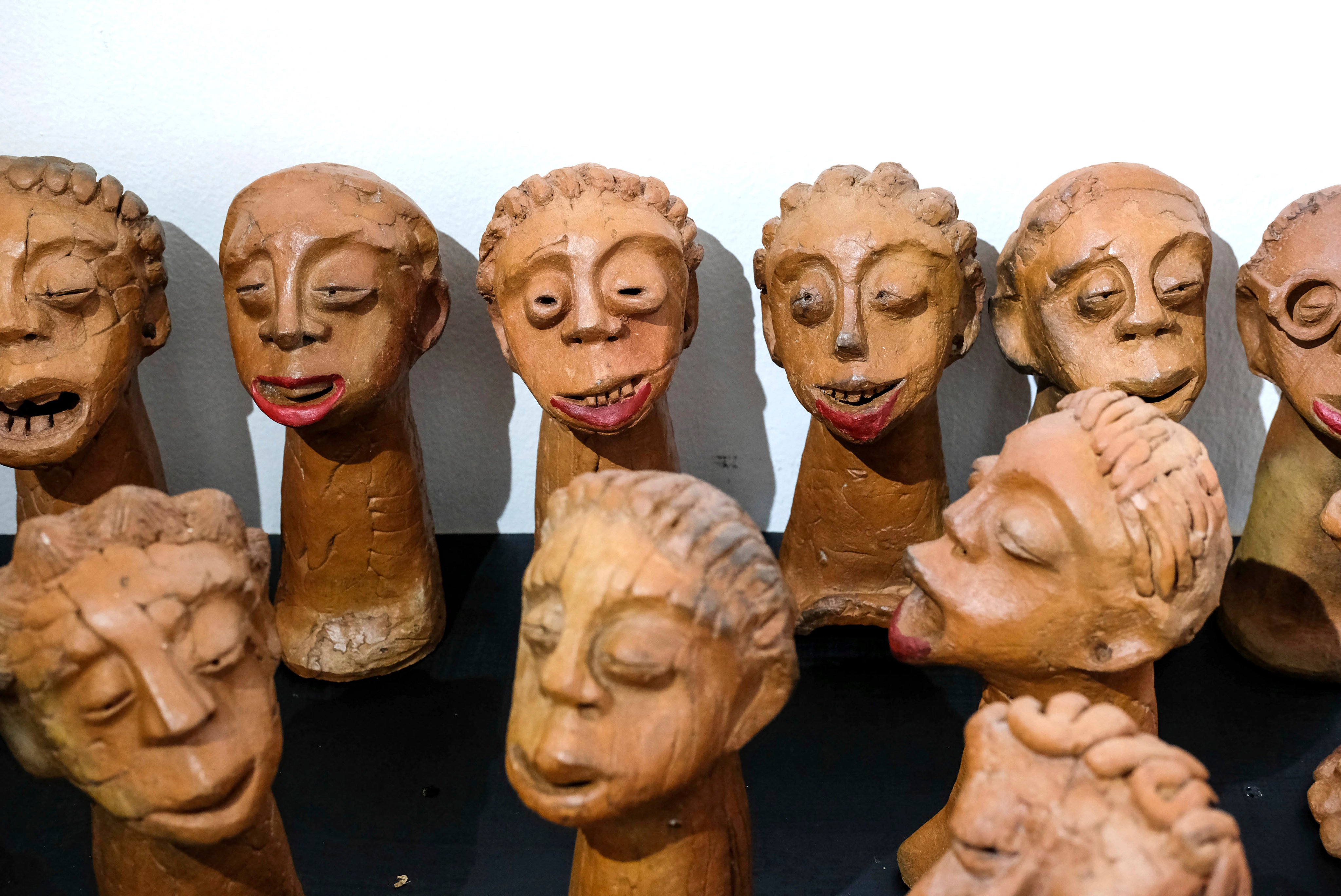 Lilian Nabulime’s clay sculpture pieces exhibited during the “Olugamba exhibition at Xenson Art Space in Kamwokya, Kampala, the capital of Uganda, Tuesday Nov. 28 2023.Lilian Nabulime hasn’t forgotten the time in the 1990s when the Ugandan capital had just one commercial art gallery, a small space that emerging artists struggled to get into. Now there are at least six in Kampala, including one whose curators recently exhibited the sculptor’s contrarian work. (AP Photo/Hajarah Nalwadda.)