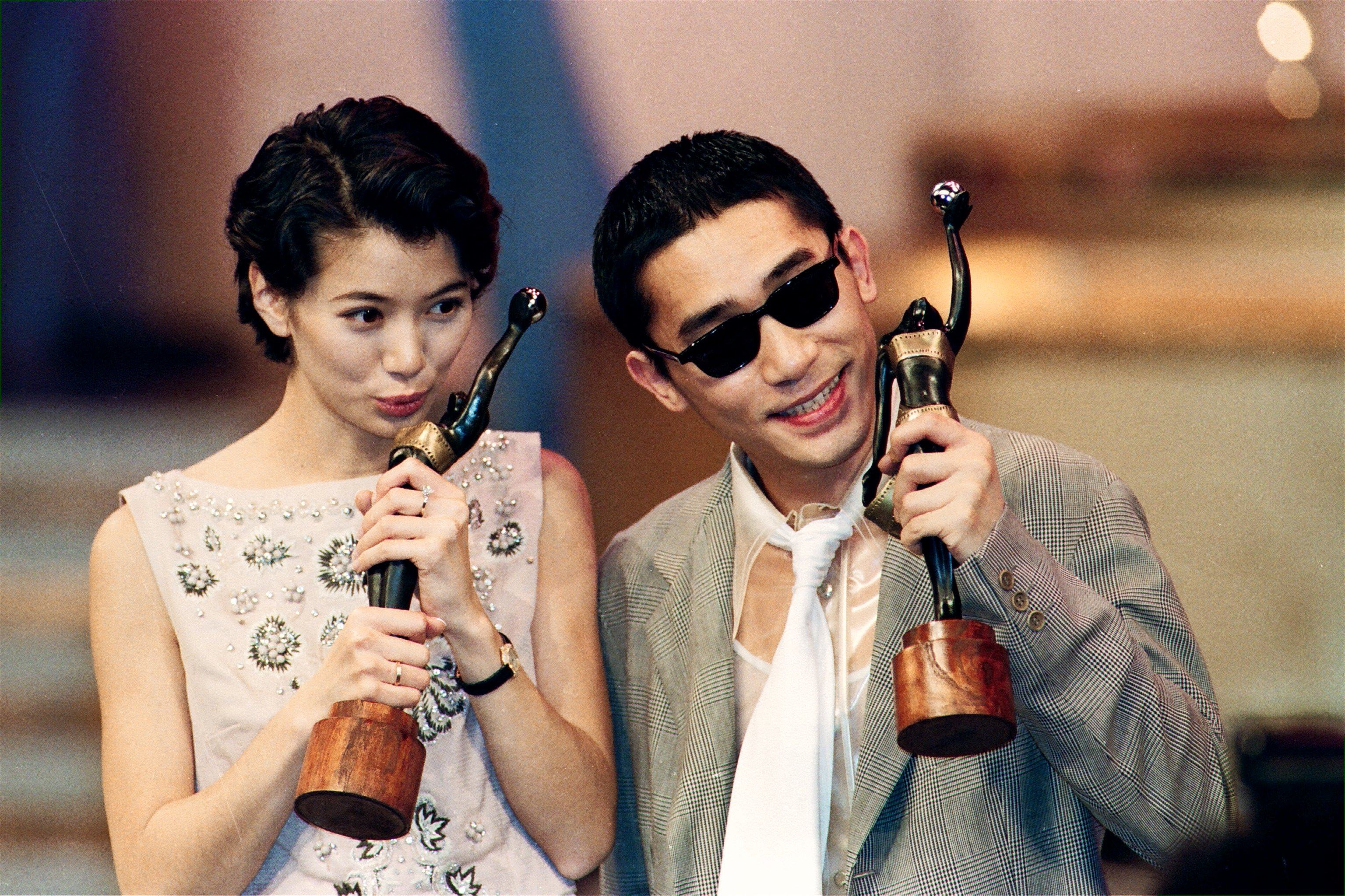 Anita Yuen Wing-yee kisses her best actress trophy while Tony Leung Chiu-wai shows off his best actor prize at the 14th Hong Kong Film Awards. Post stories about the entertainment careers of Yuen and Leung were among our most popular celebrity profiles with readers in 2023.