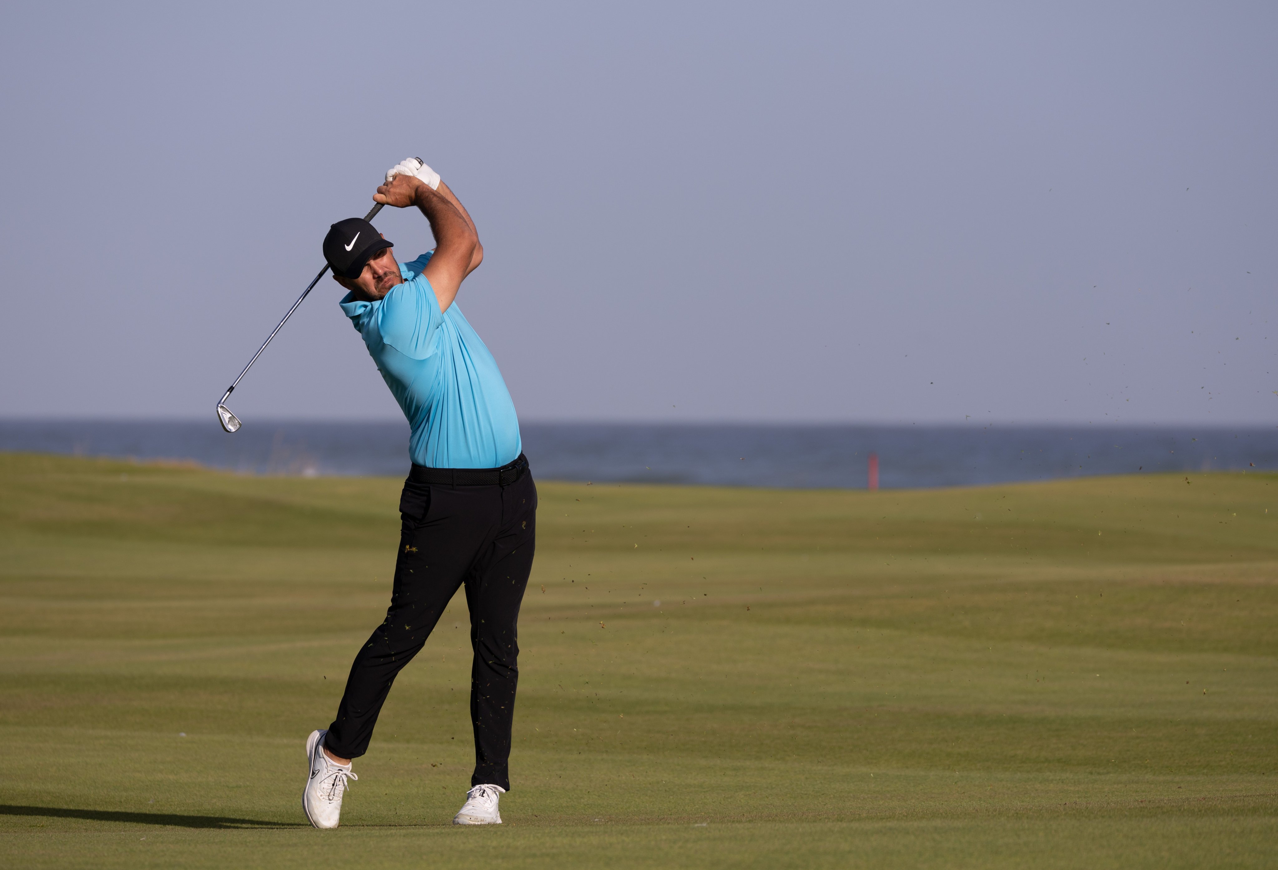 Brooks Koepka hits an approach during the second round of the International Series Oman at Al Mouj Golf Club, on February 10. Photo: Asian Tour