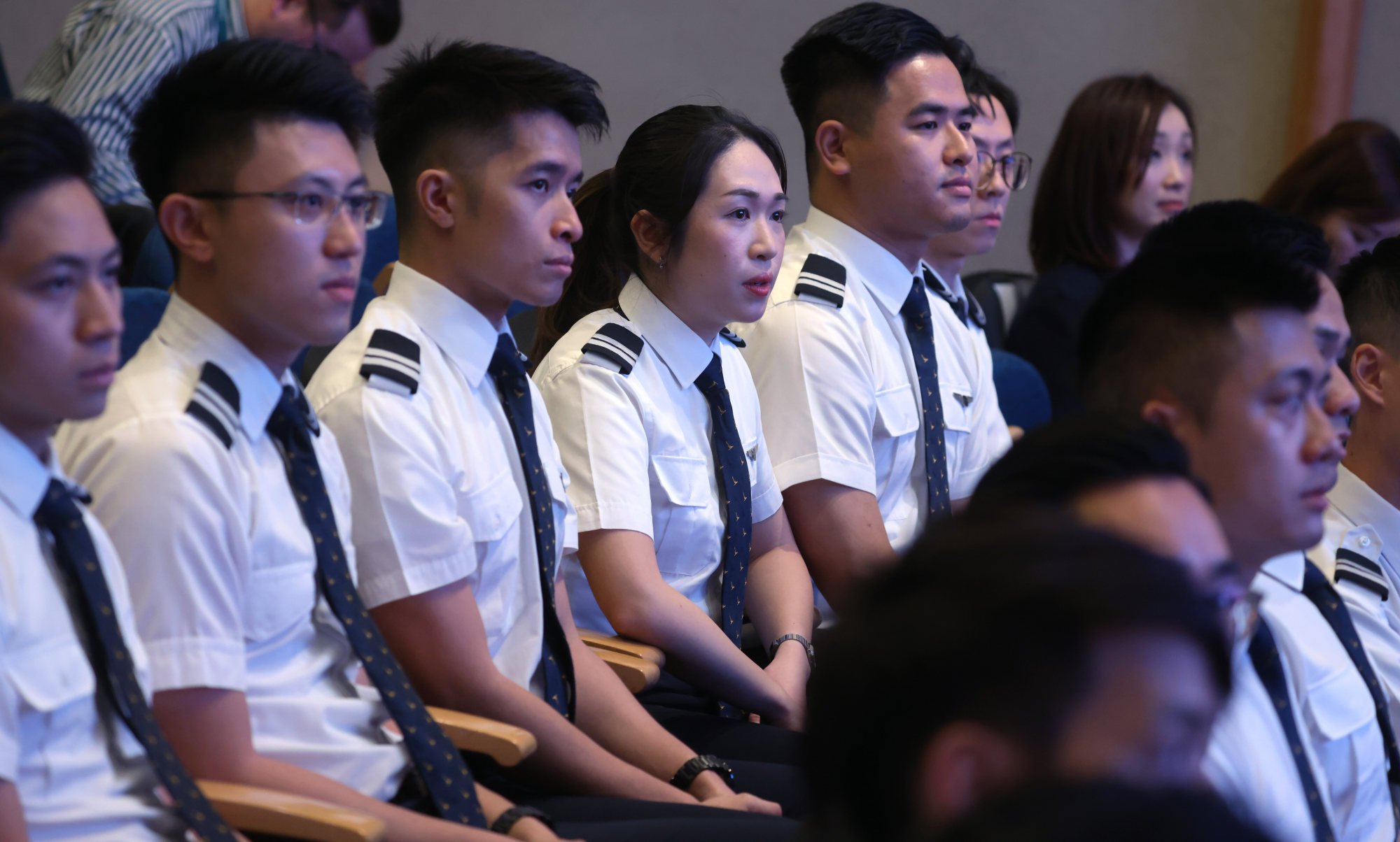 Cathay Pacific cadet pilots attend their graduation ceremony after finishing a 75-week course earlier this month. Photo: Yik Yeung-man