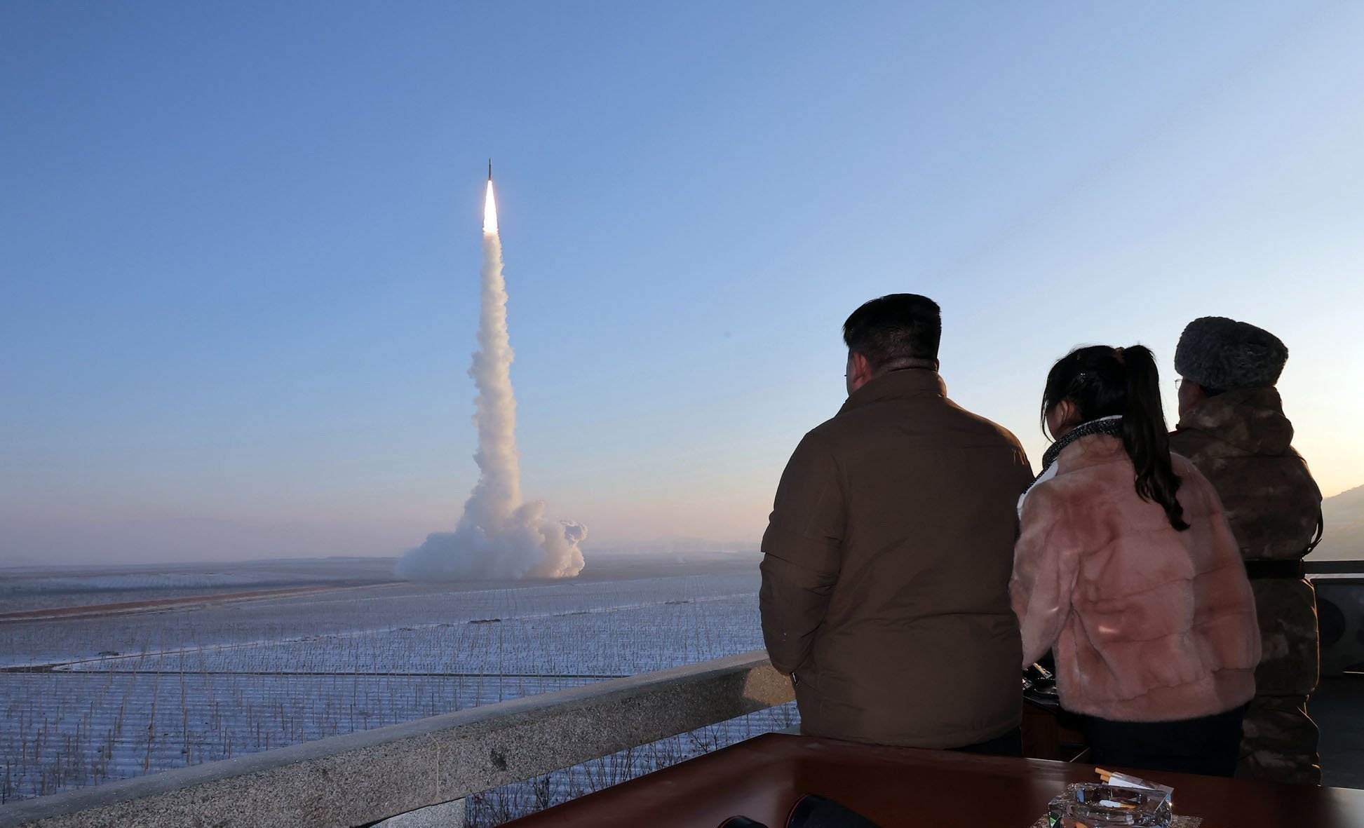 An image released by North Korean news agency KCNA shows the country’s leader, Kim Jong-un (left), and his daughter Kim Ju-ae (second left) watching a test launch of an intercontinental ballistic missile at an undisclosed location on Monday. Photo: KCNA/KNS/dpa