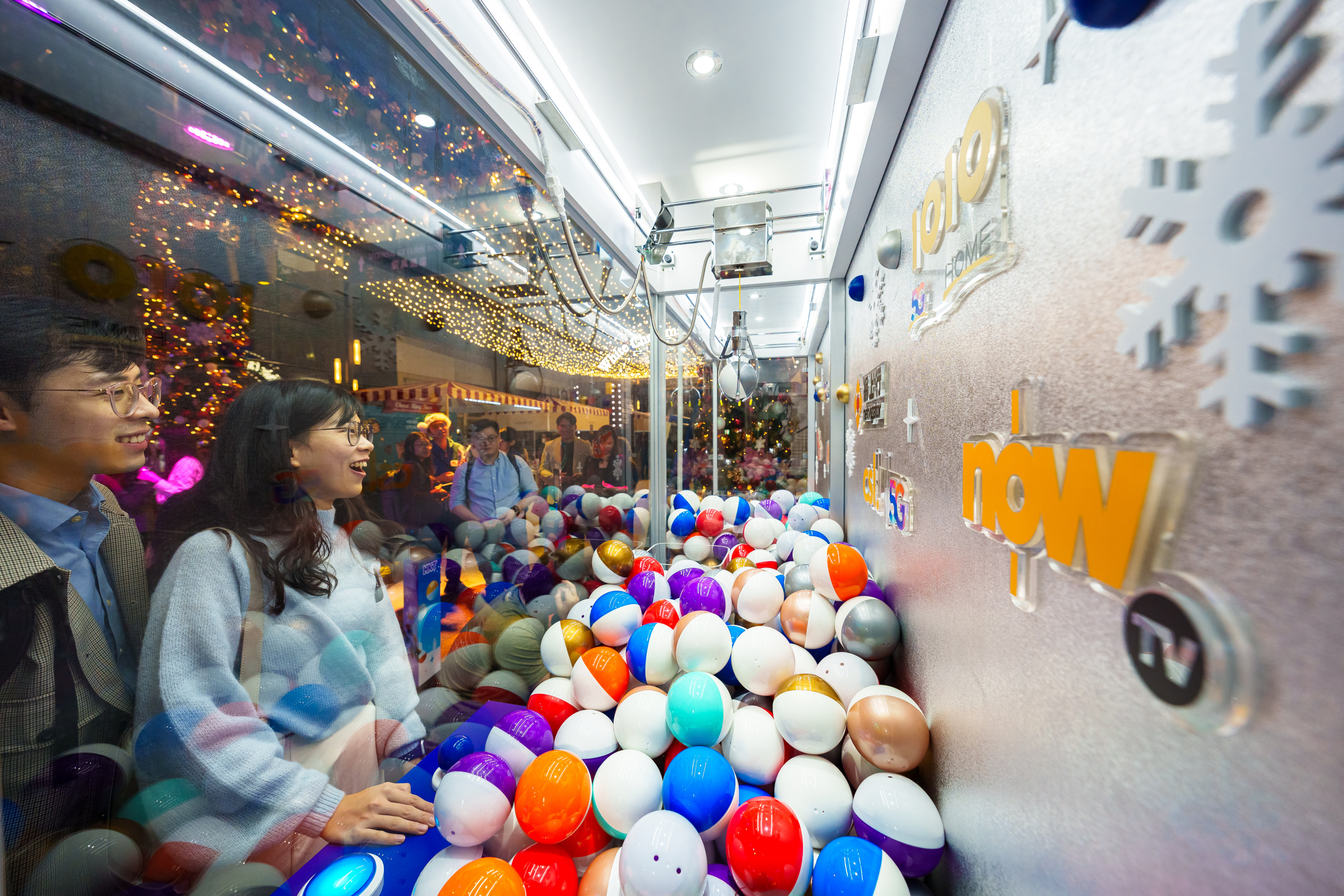 Everyone making a HK$20 donation to OSC to play at HKT’s giant claw booth was able to win a prize. Photo: SCMP