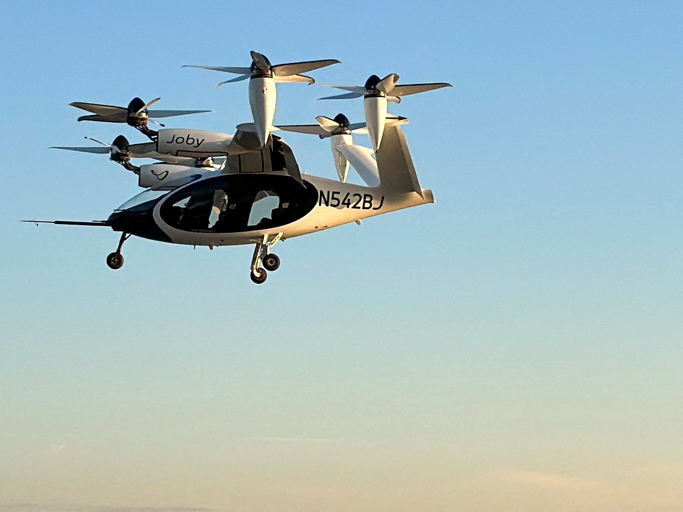 An electric air taxi by Joby Aviation flies above New York City in the US. Photo: Reuters