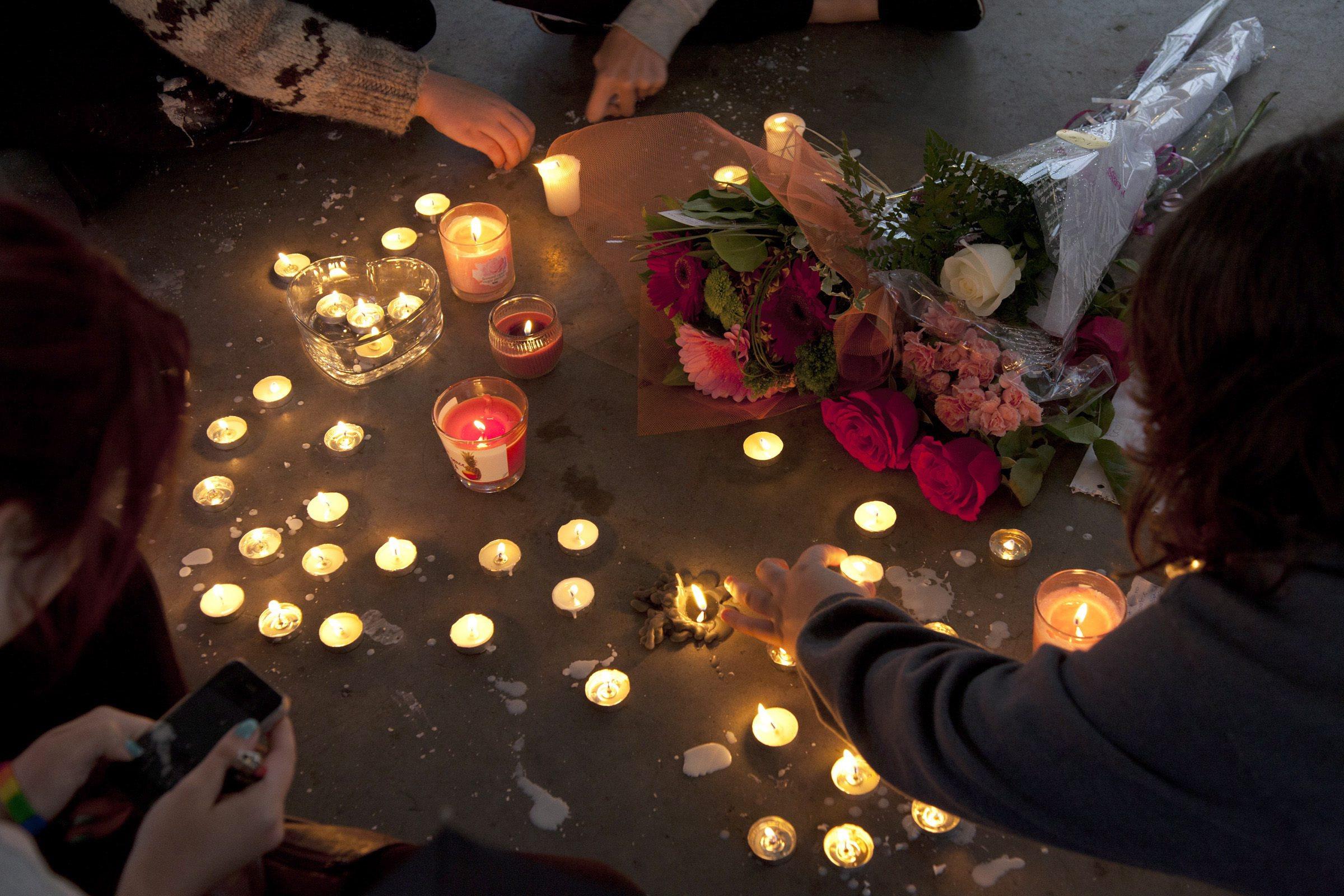 People gather at a memorial in the Canadian city of Maple Ridge, British Columbia, honouring teenager Amanda Todd in October 2012. Todd took her own life following a cyberbullying and sexual extortion campaign by Aydin Coban. Photo: AP/The Canadian Press